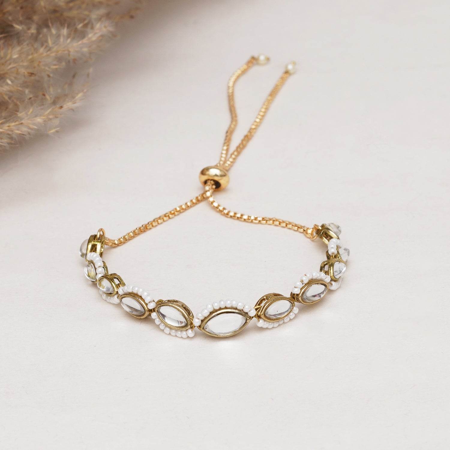 Golden Oval Shape Kundan & White Pearl Adjustable Bracelet - BeAbhika.com