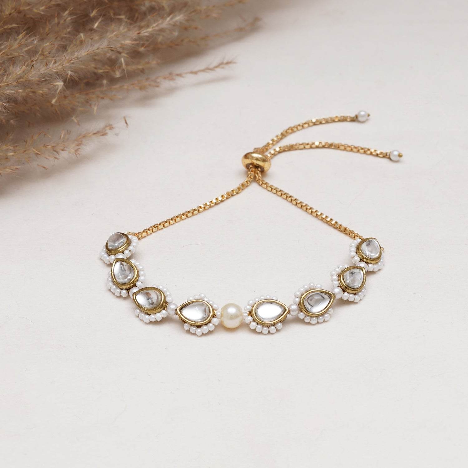 Golden Tilak Kundan With White Pearls Adjustable Bracelet - BeAbhika.com