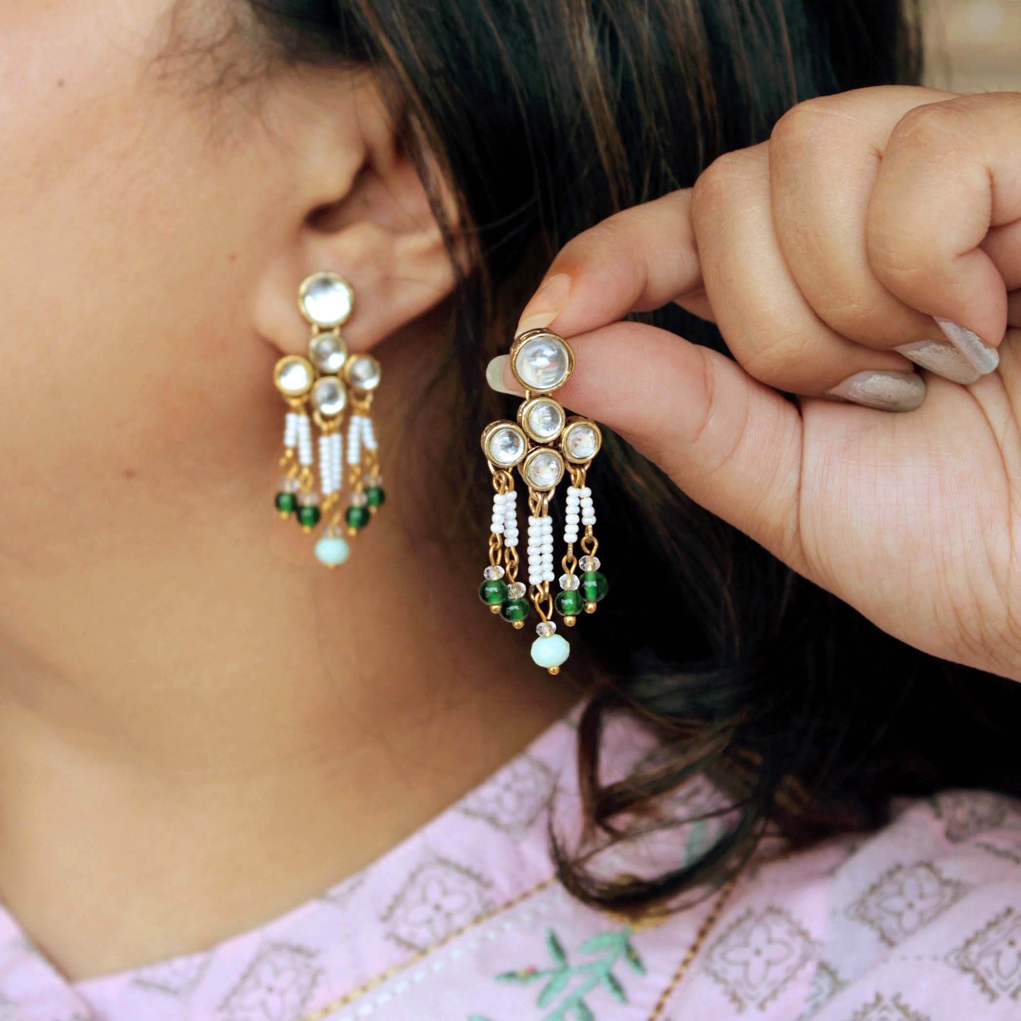 Traditional Kundan earrings in gold-tone, perfect for weddings and festive wear