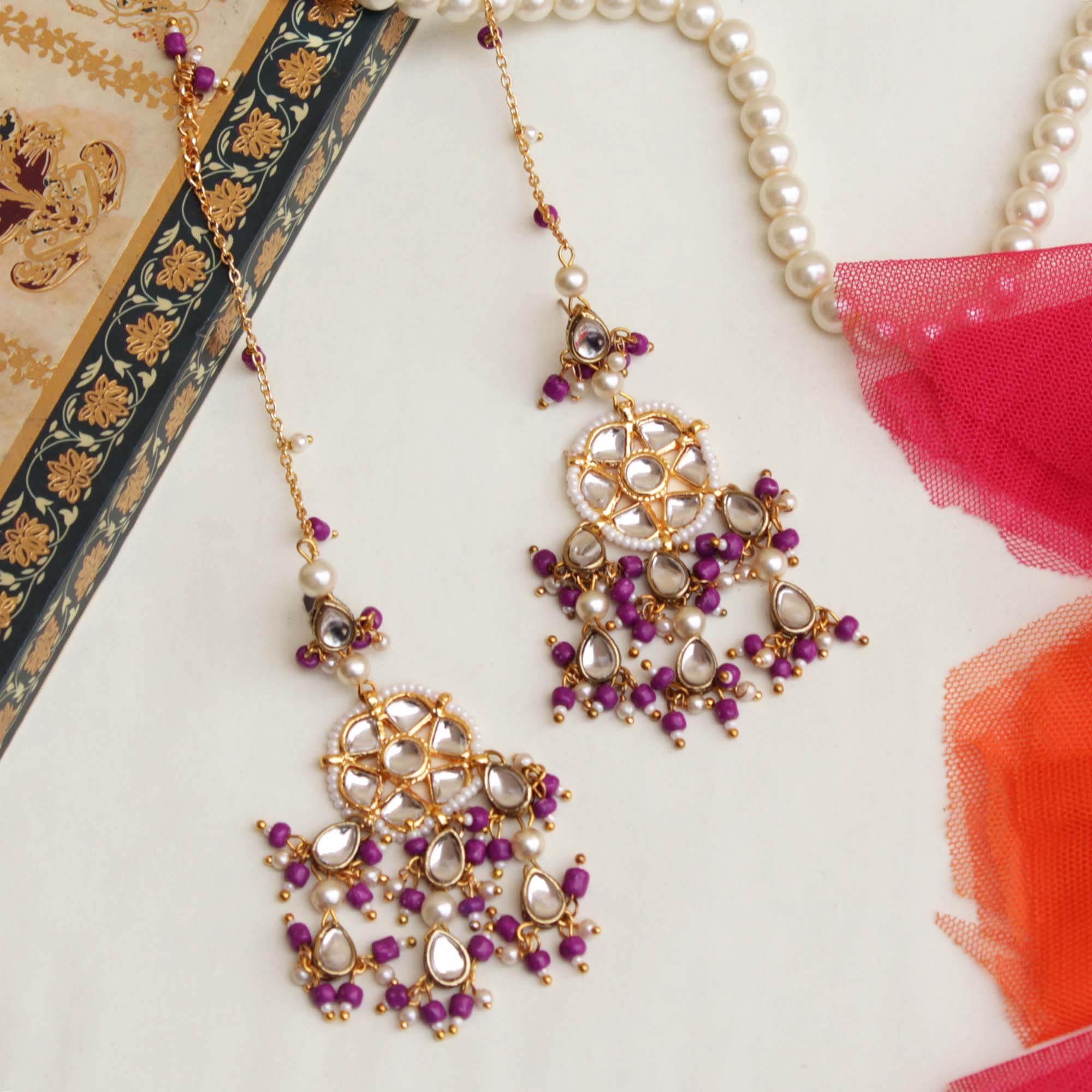Traditional Kundan earrings in gold-tone, perfect for weddings and festive wear