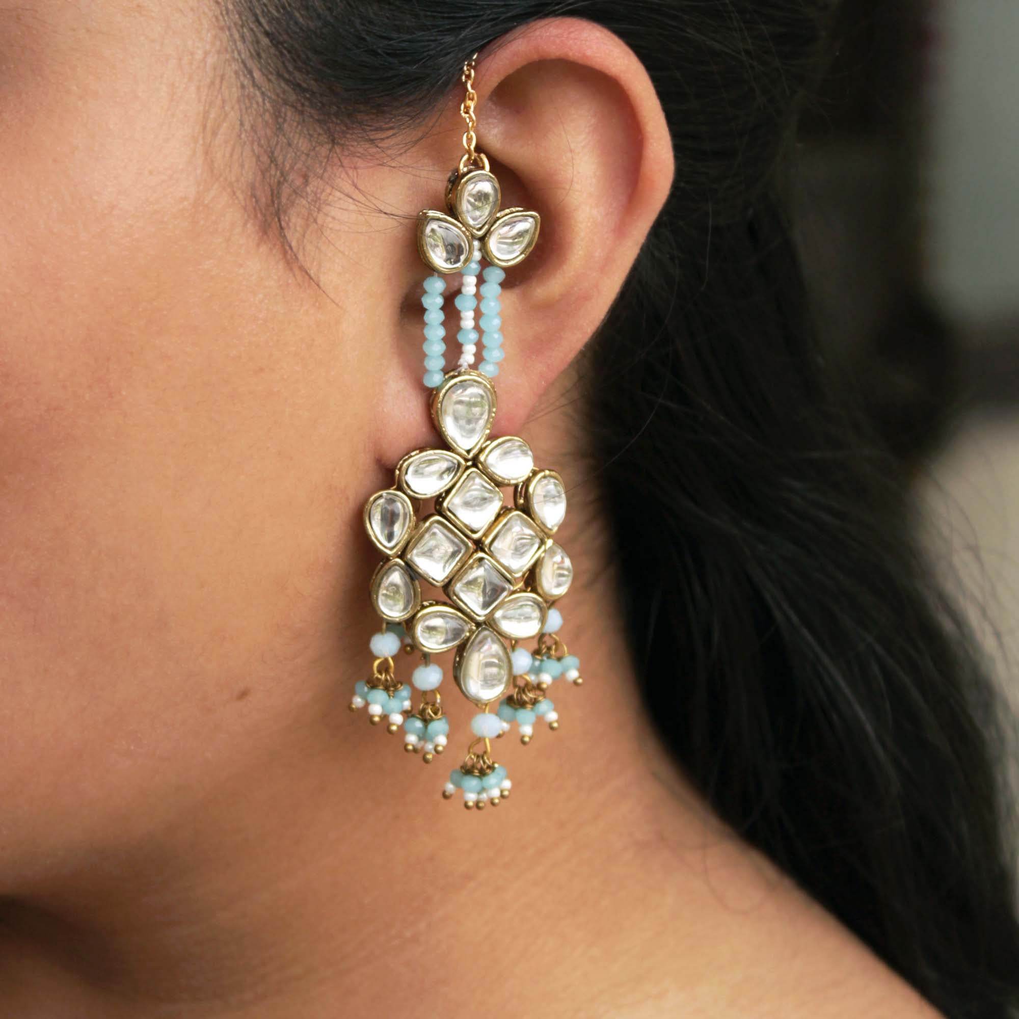 Traditional Kundan earrings in gold-tone, perfect for weddings and festive wear