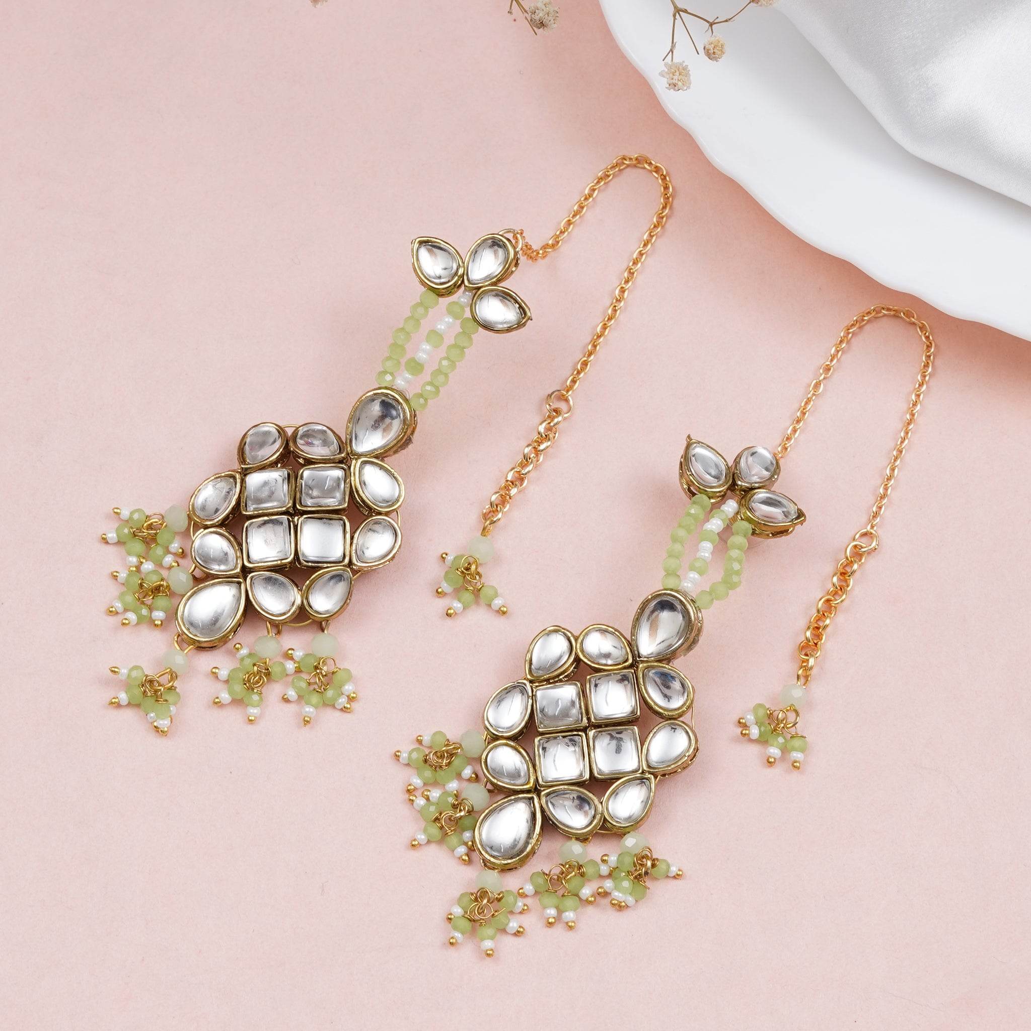 Traditional Kundan earrings in gold-tone, perfect for weddings and festive wear