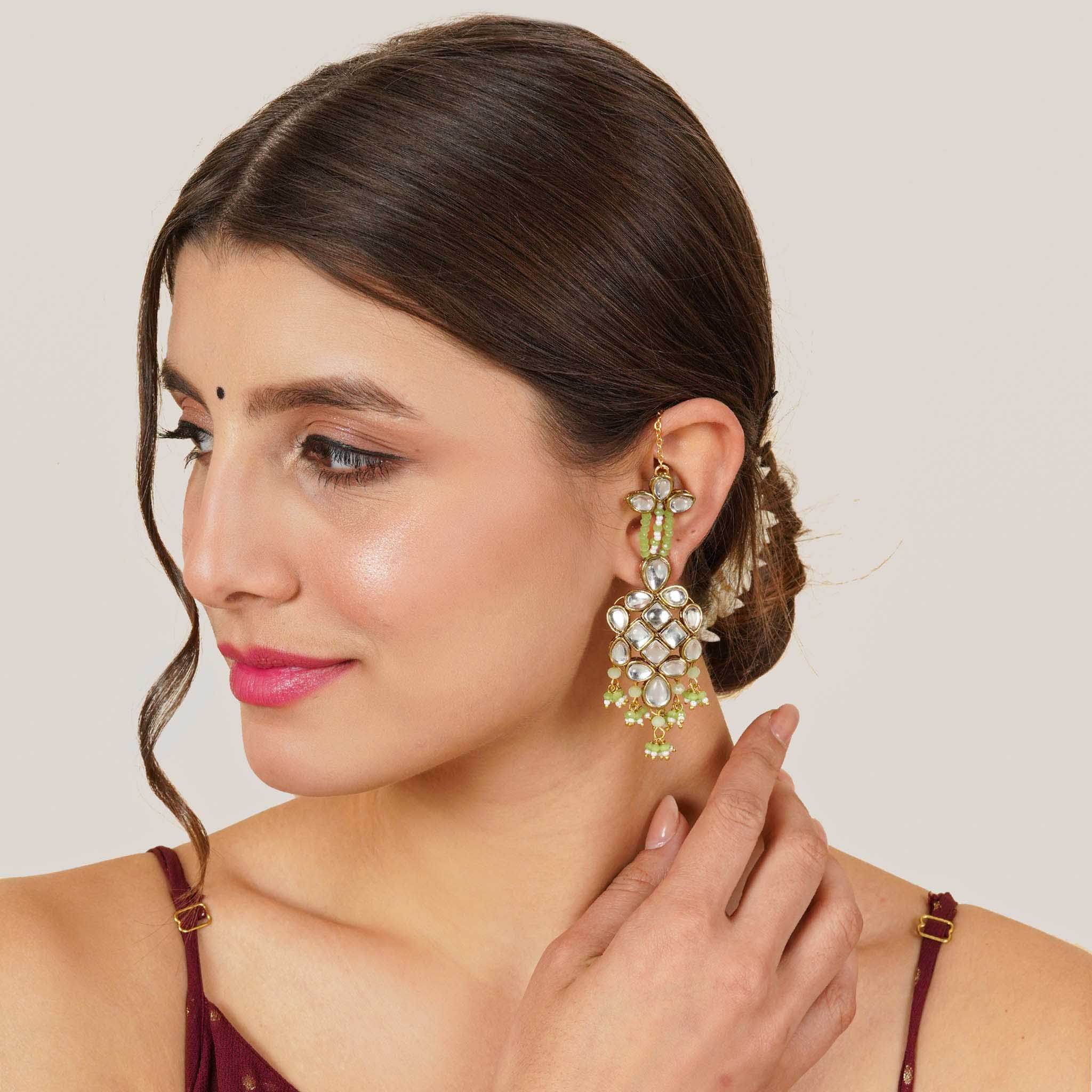 Traditional Kundan earrings in gold-tone, perfect for weddings and festive wear