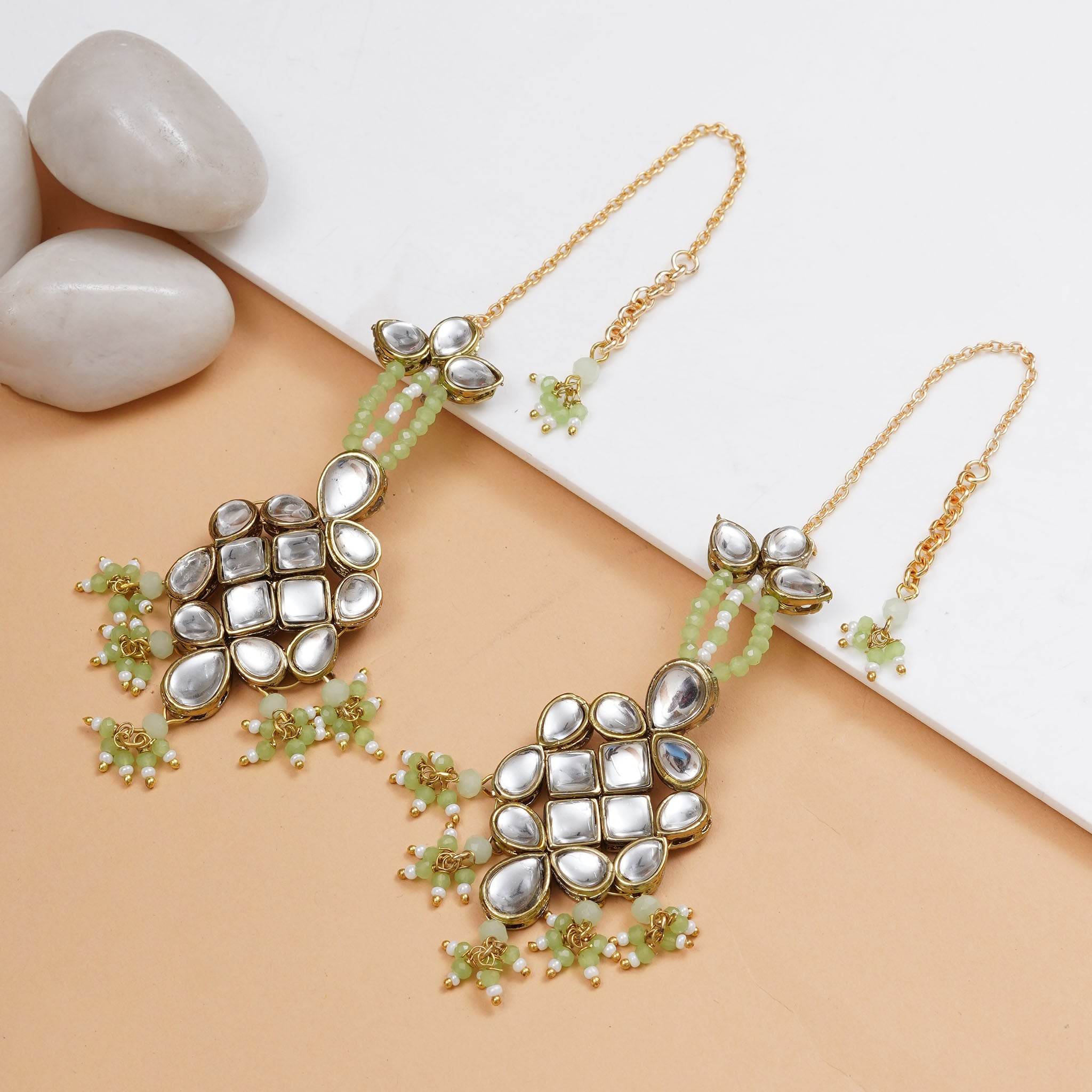 Traditional Kundan earrings in gold-tone, perfect for weddings and festive wear
