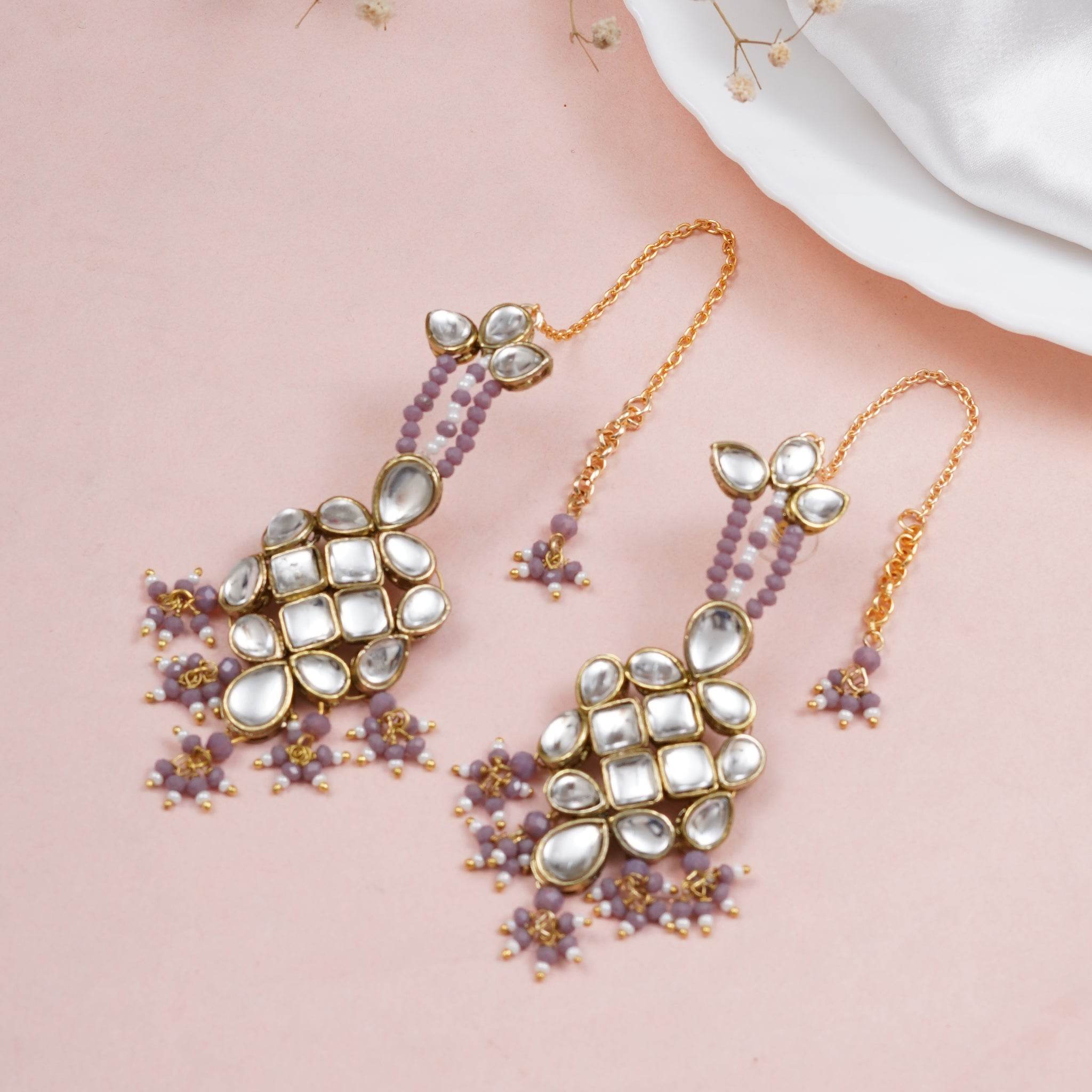 Traditional Kundan earrings in gold-tone, perfect for weddings and festive wear