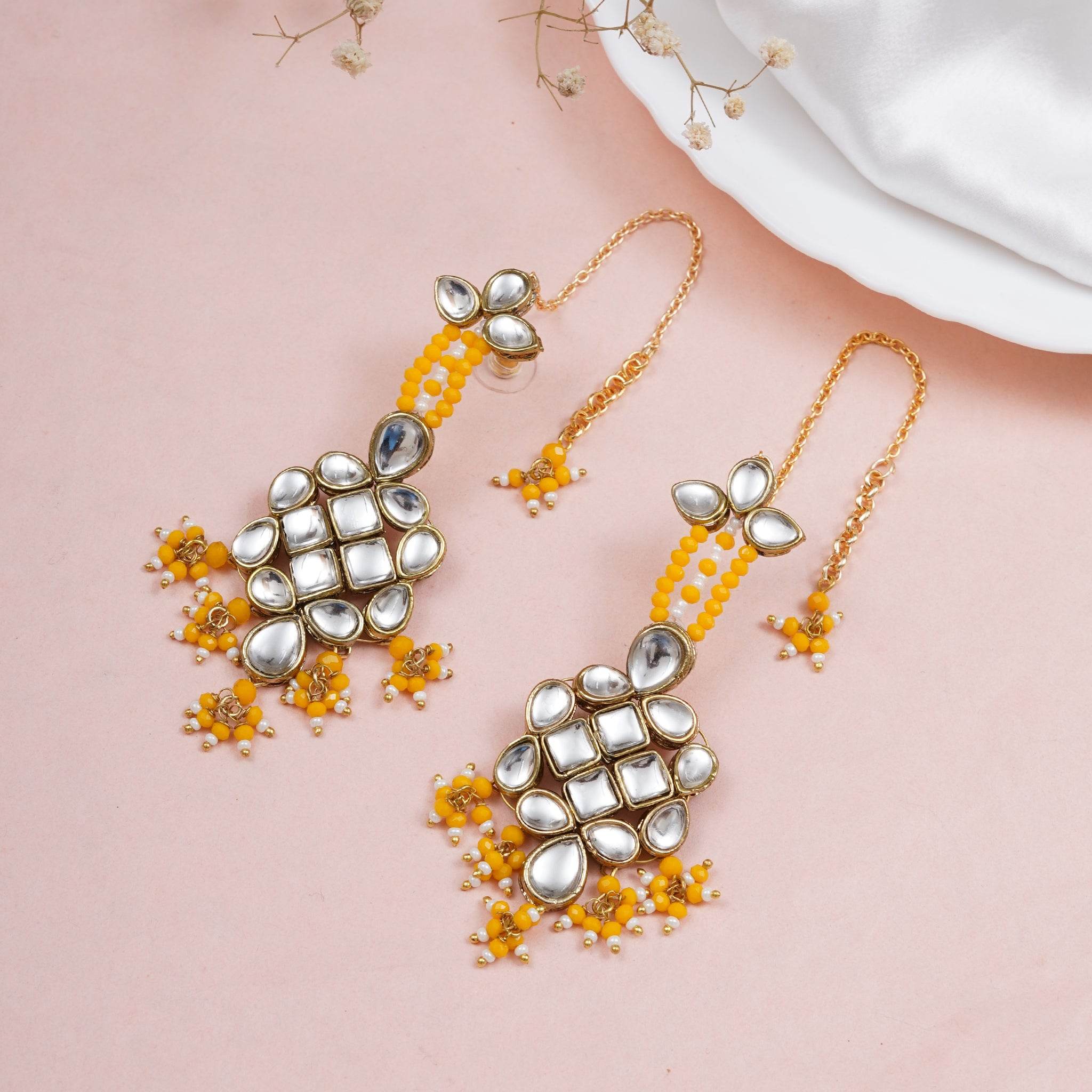 Traditional Kundan earrings in gold-tone, perfect for weddings and festive wear