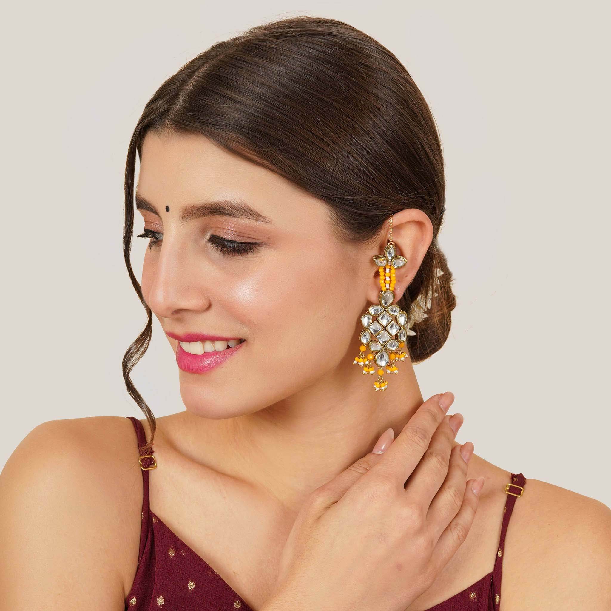 Traditional Kundan earrings in gold-tone, perfect for weddings and festive wear