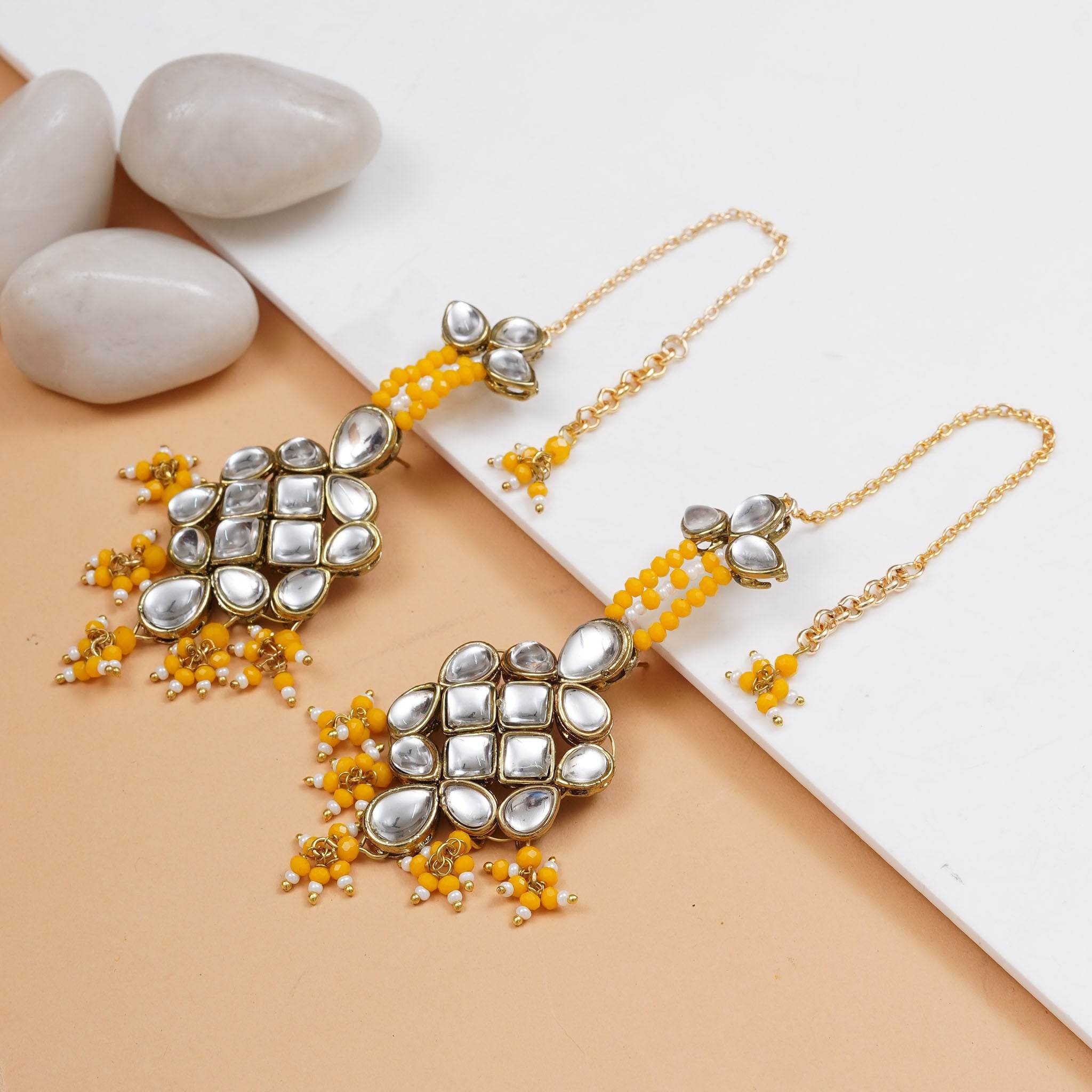 Traditional Kundan earrings in gold-tone, perfect for weddings and festive wear