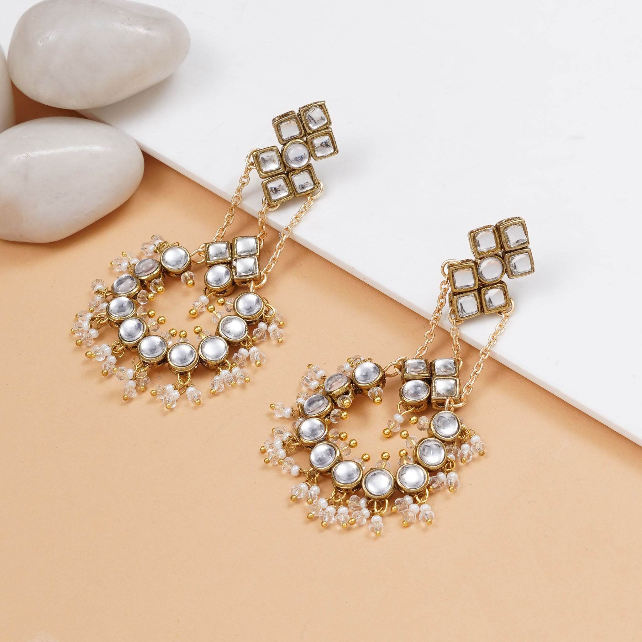 Traditional Kundan earrings in gold-tone, perfect for weddings and festive wear