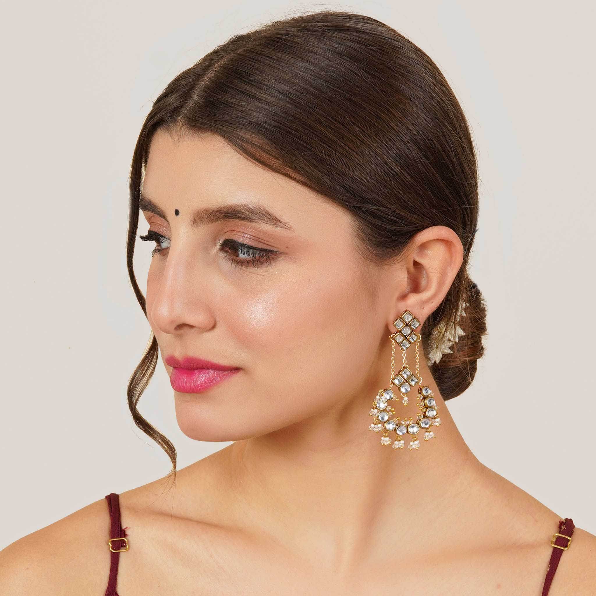 Traditional Kundan earrings in gold-tone, perfect for weddings and festive wear