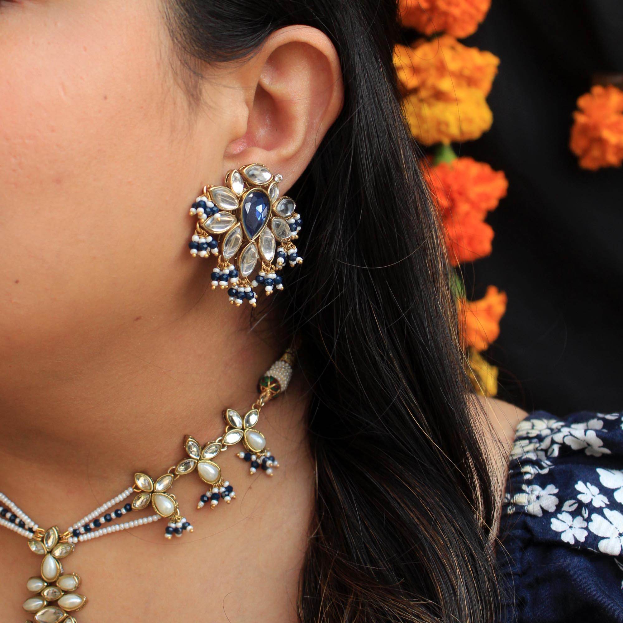 Traditional Kundan earrings in gold-tone, perfect for weddings and festive wear