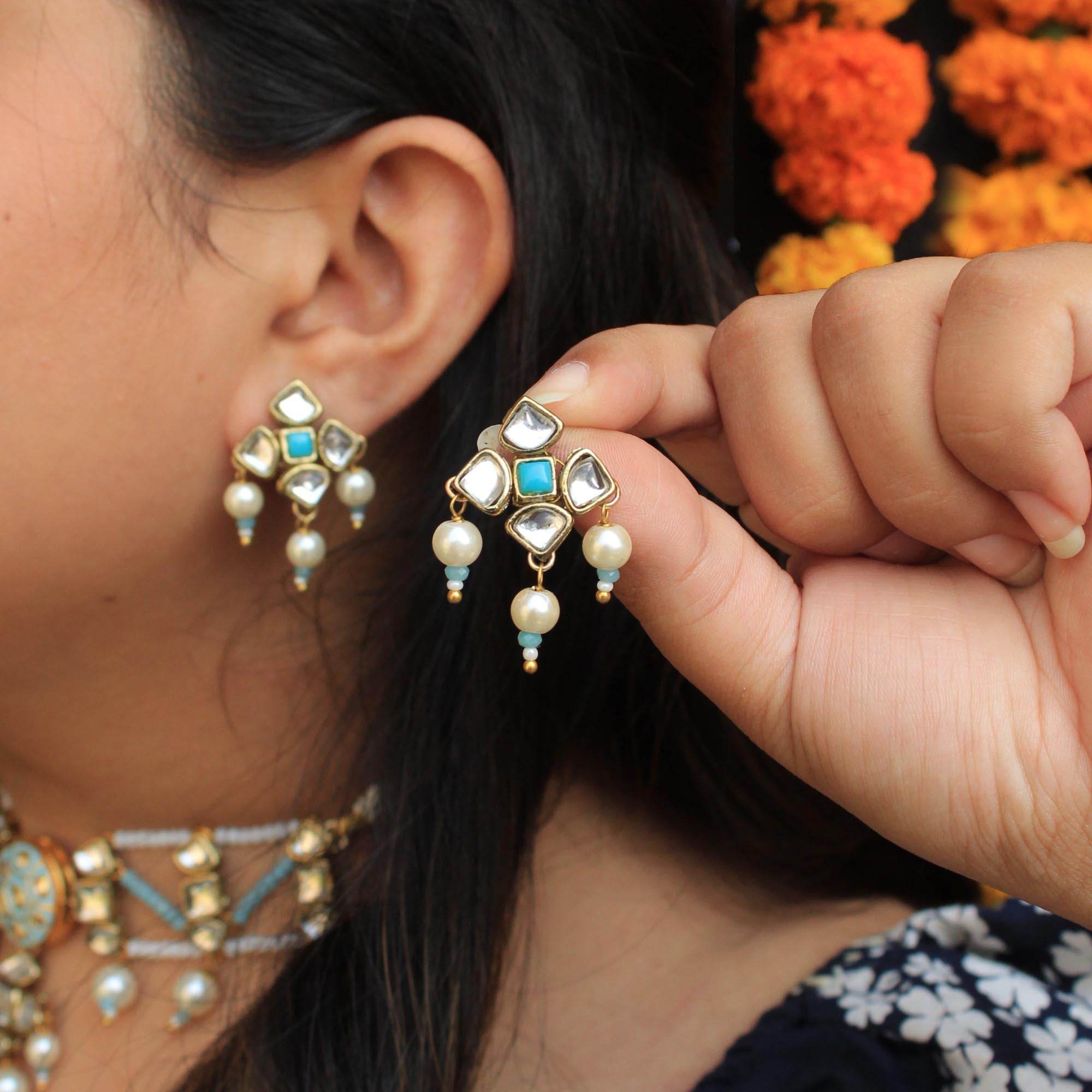 Traditional Kundan earrings in gold-tone, perfect for weddings and festive wear