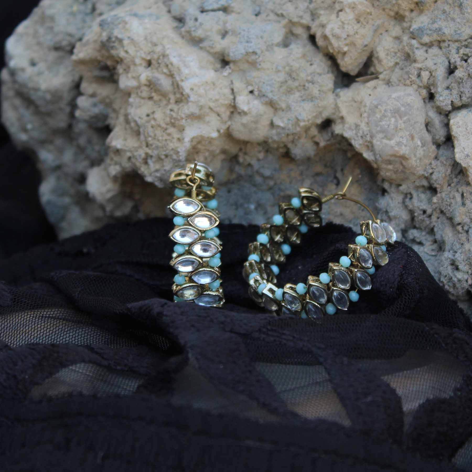 Traditional Kundan earrings in gold-tone, perfect for weddings and festive wear