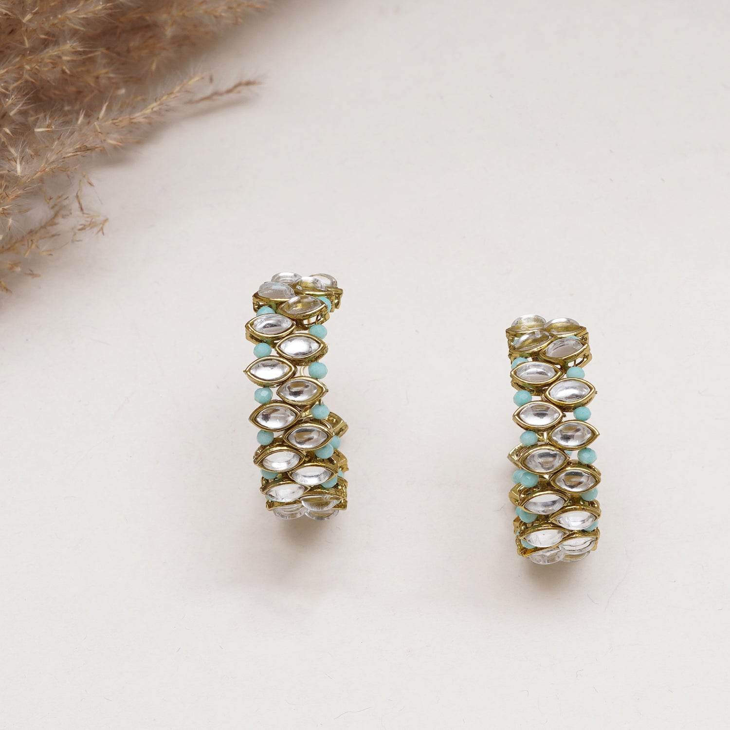 Traditional Kundan earrings in gold-tone, perfect for weddings and festive wear