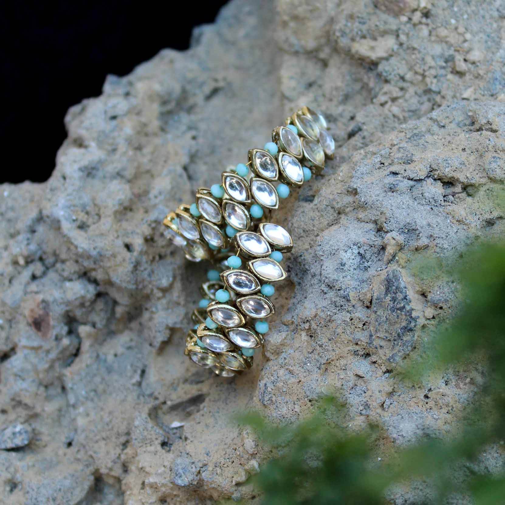 Traditional Kundan earrings in gold-tone, perfect for weddings and festive wear