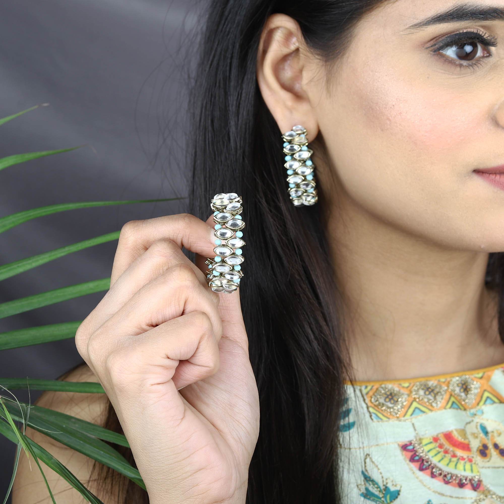Traditional Kundan earrings in gold-tone, perfect for weddings and festive wear