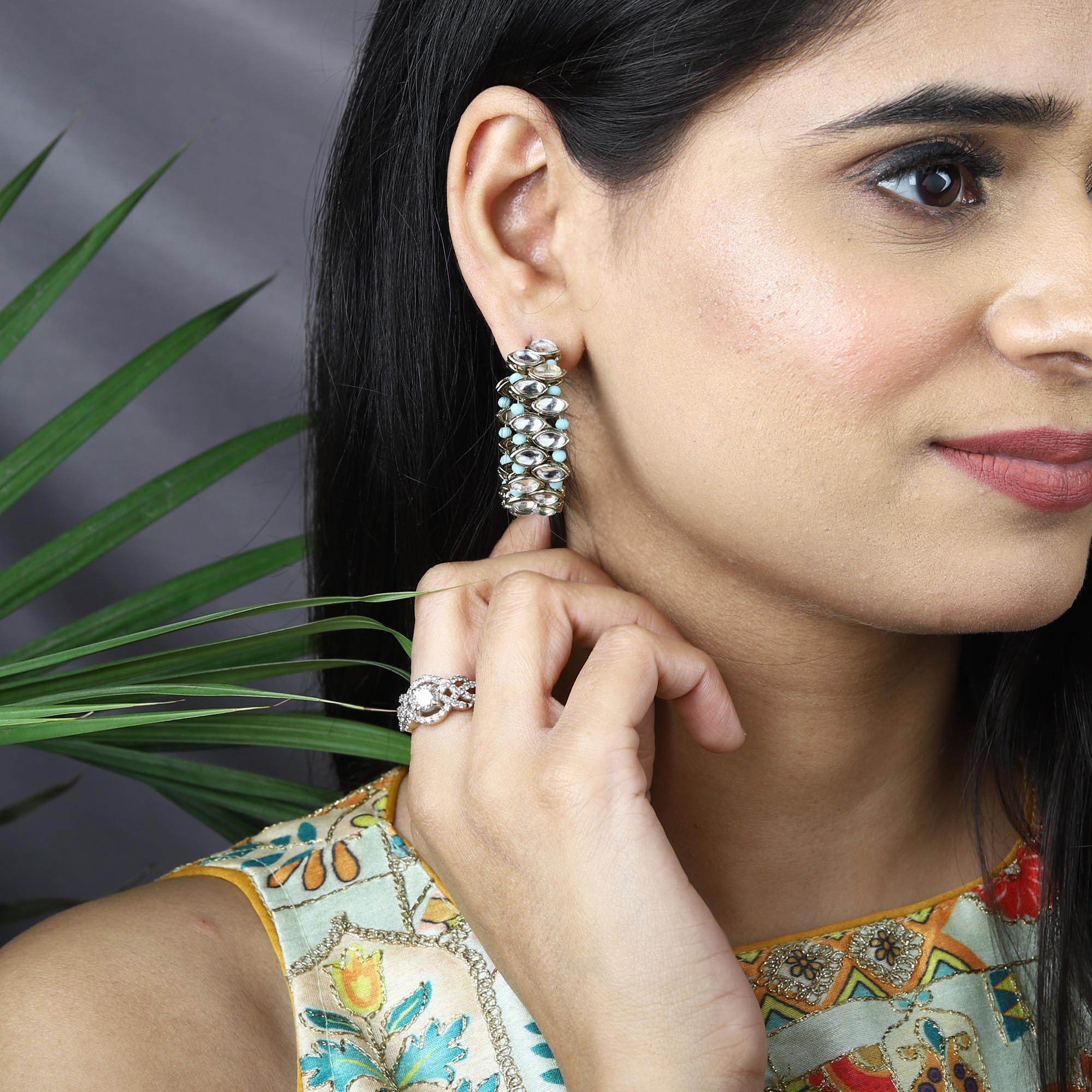 Traditional Kundan earrings in gold-tone, perfect for weddings and festive wear