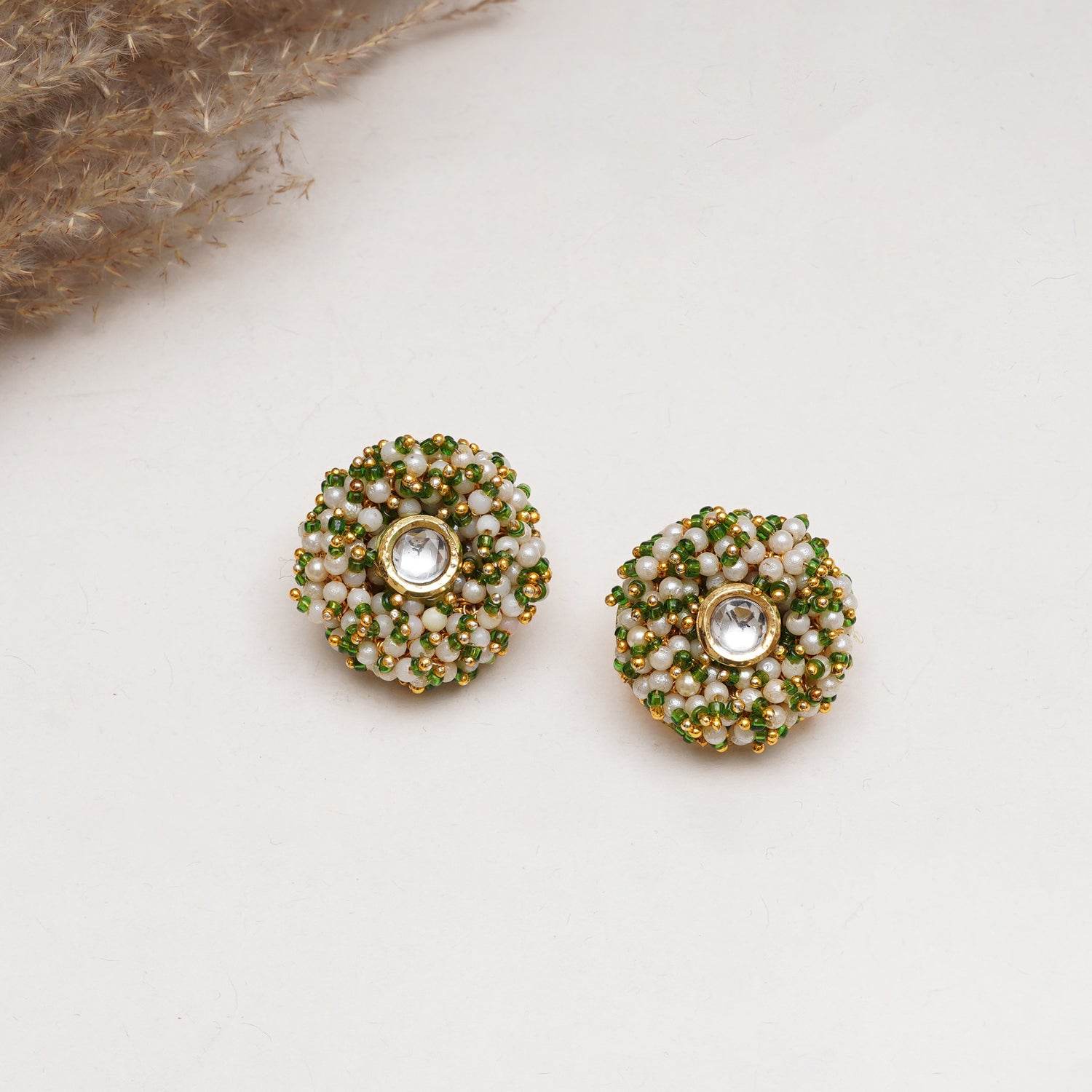 Traditional Kundan earrings in gold-tone, perfect for weddings and festive wear