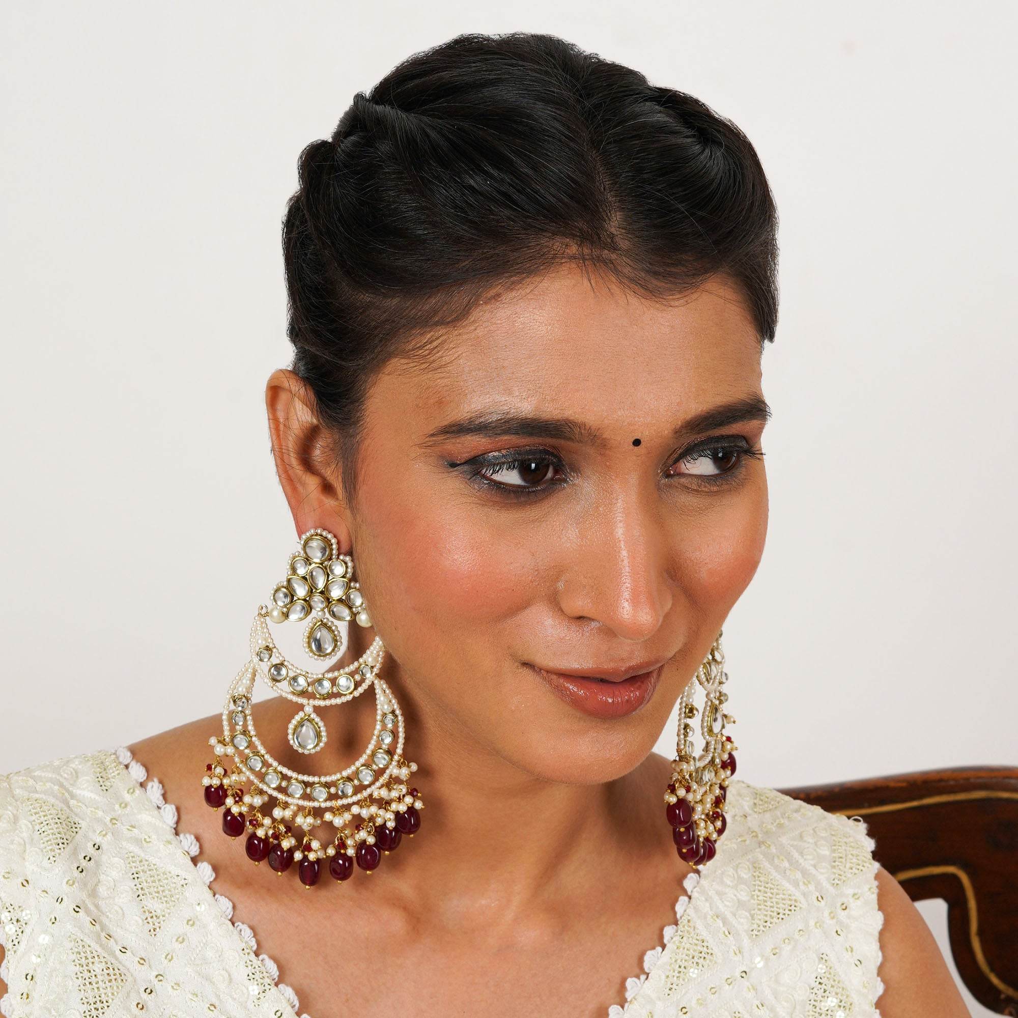 Traditional Kundan earrings in gold-tone, perfect for weddings and festive wear