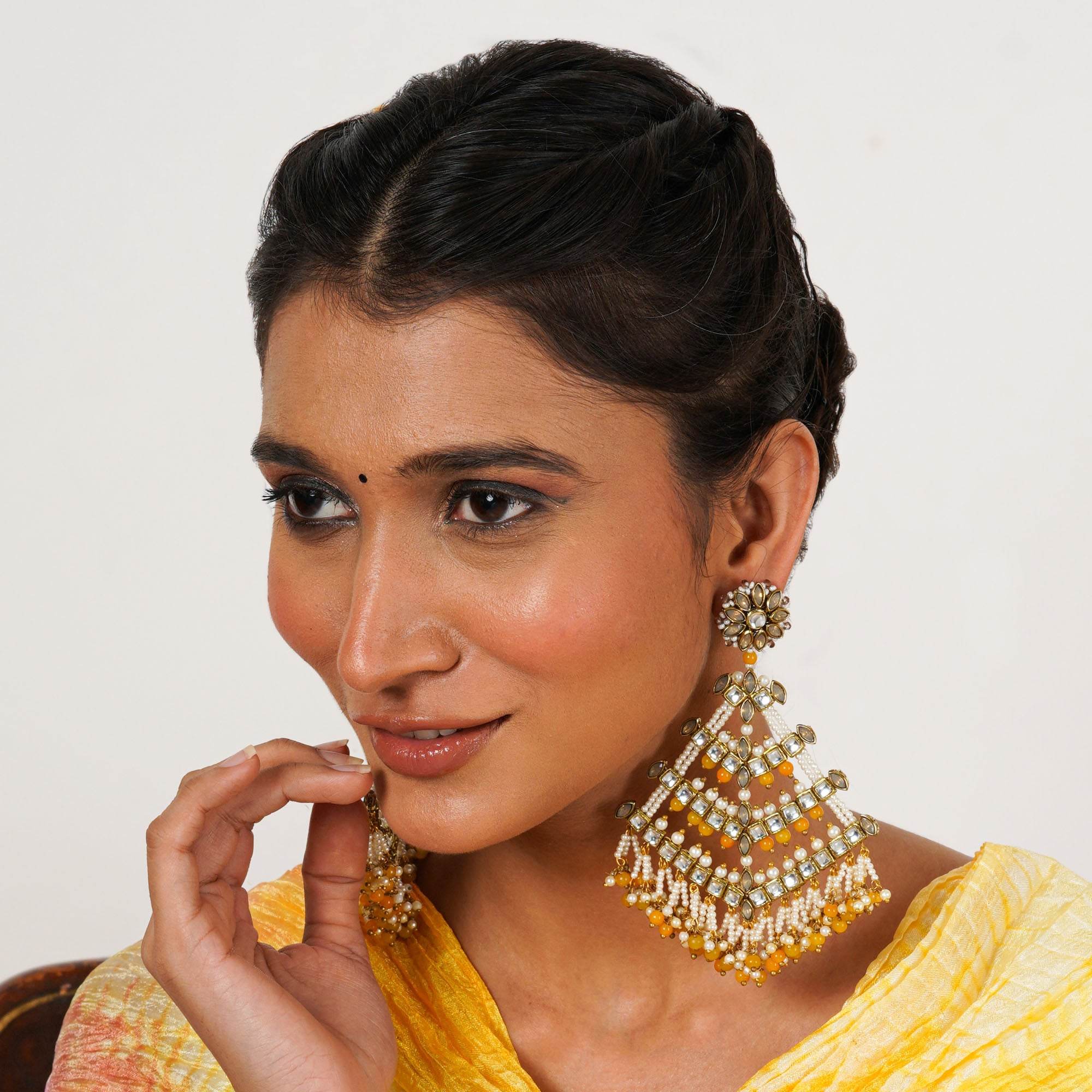 Traditional Kundan earrings in gold-tone, perfect for weddings and festive wear