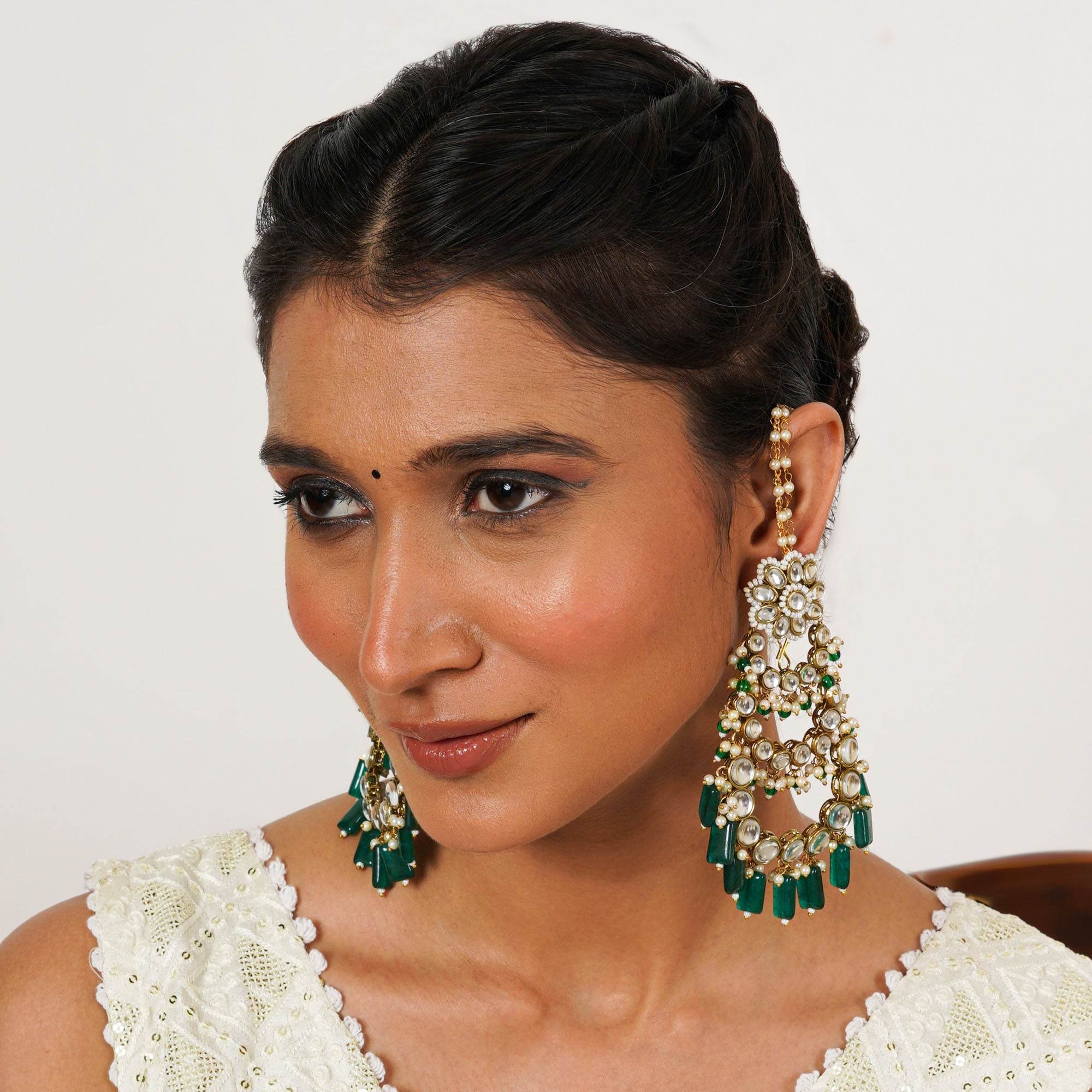Traditional Kundan earrings in gold-tone, perfect for weddings and festive wear
