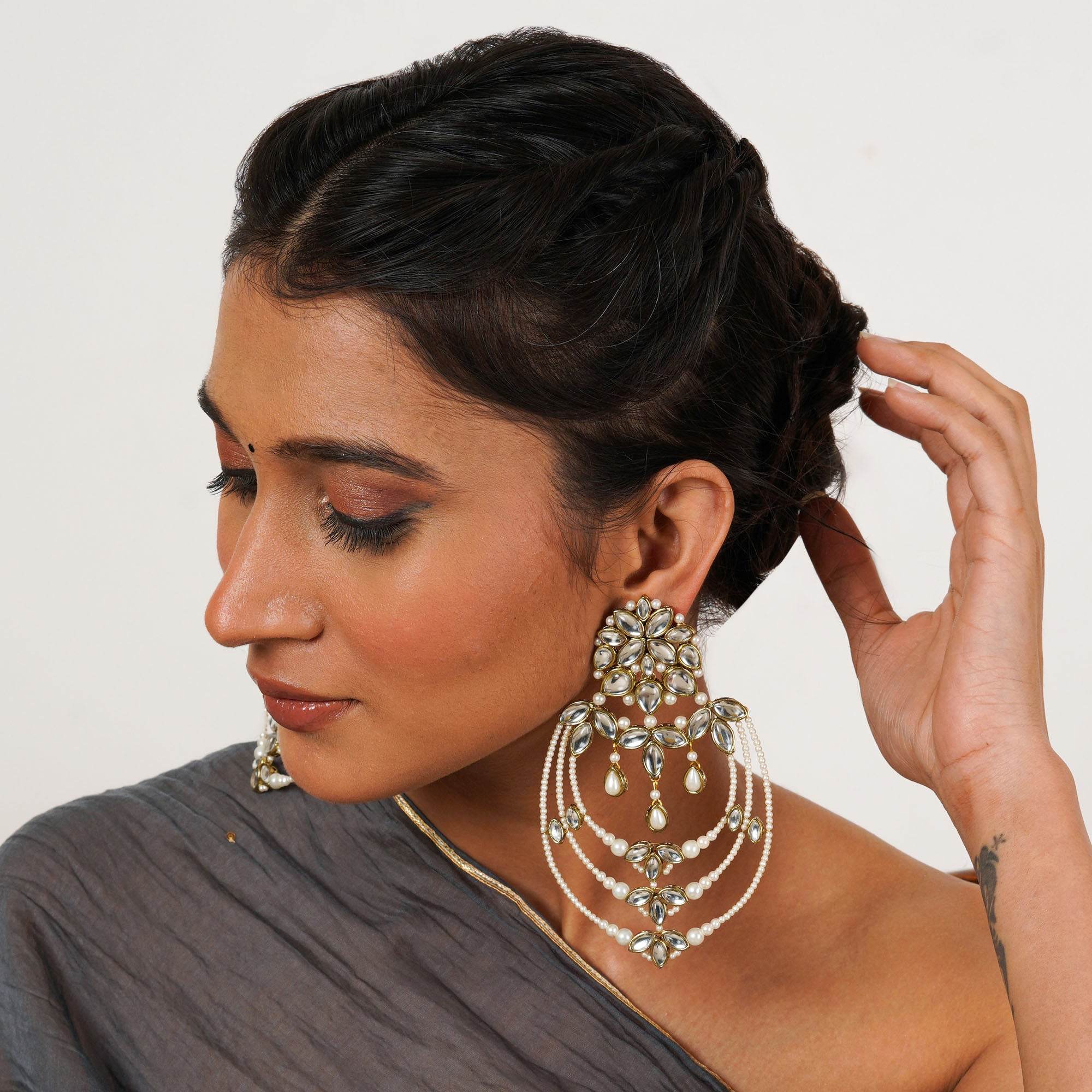 Traditional Kundan earrings in gold-tone, perfect for weddings and festive wear