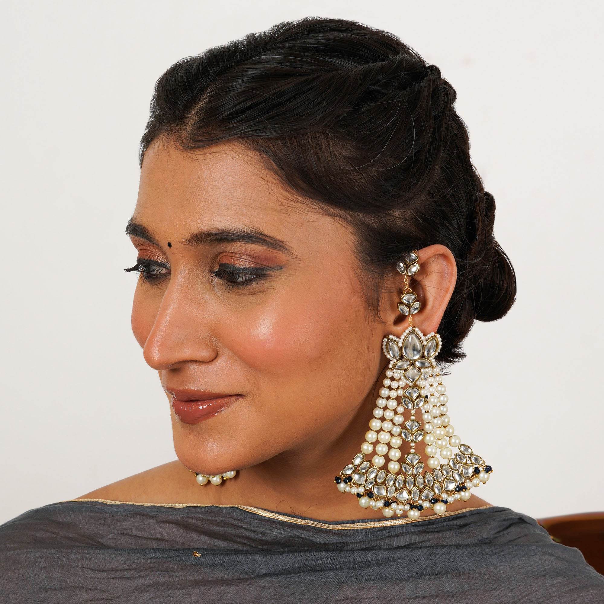 Traditional Kundan earrings in gold-tone, perfect for weddings and festive wear