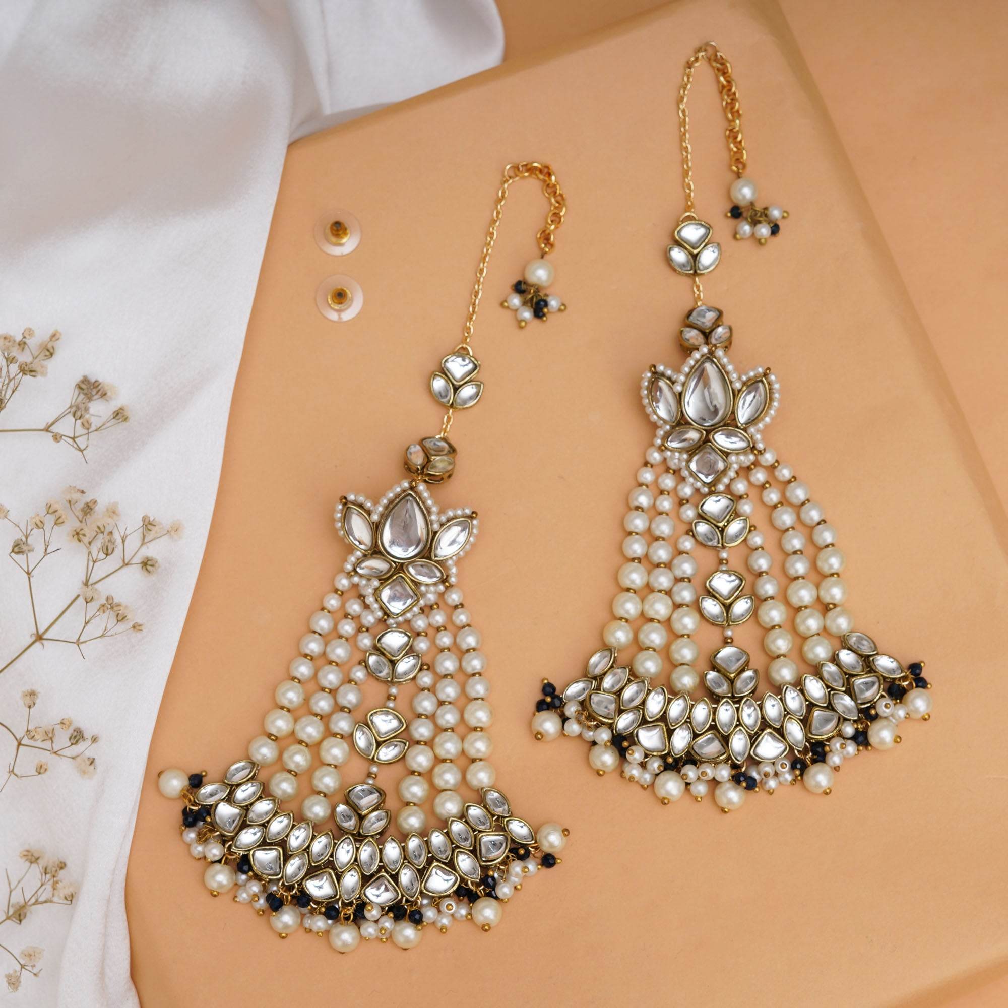 Traditional Kundan earrings in gold-tone, perfect for weddings and festive wear