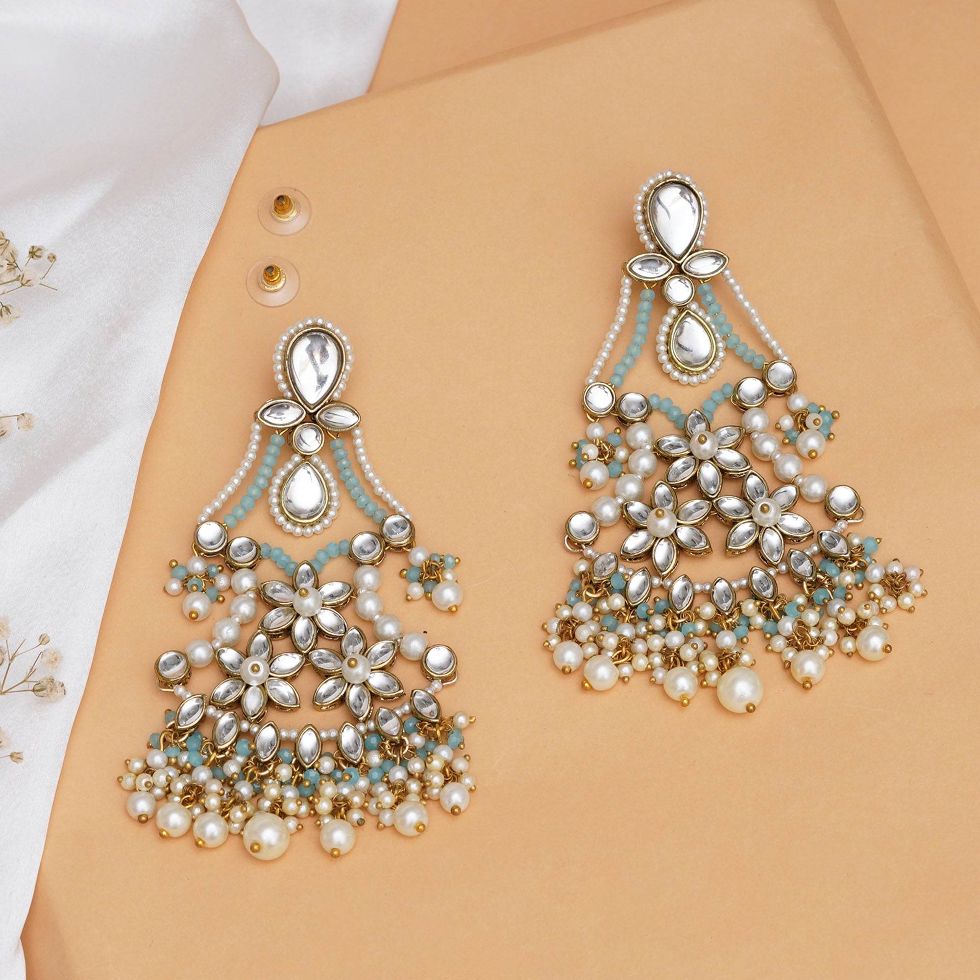 Traditional Kundan earrings in gold-tone, perfect for weddings and festive wear