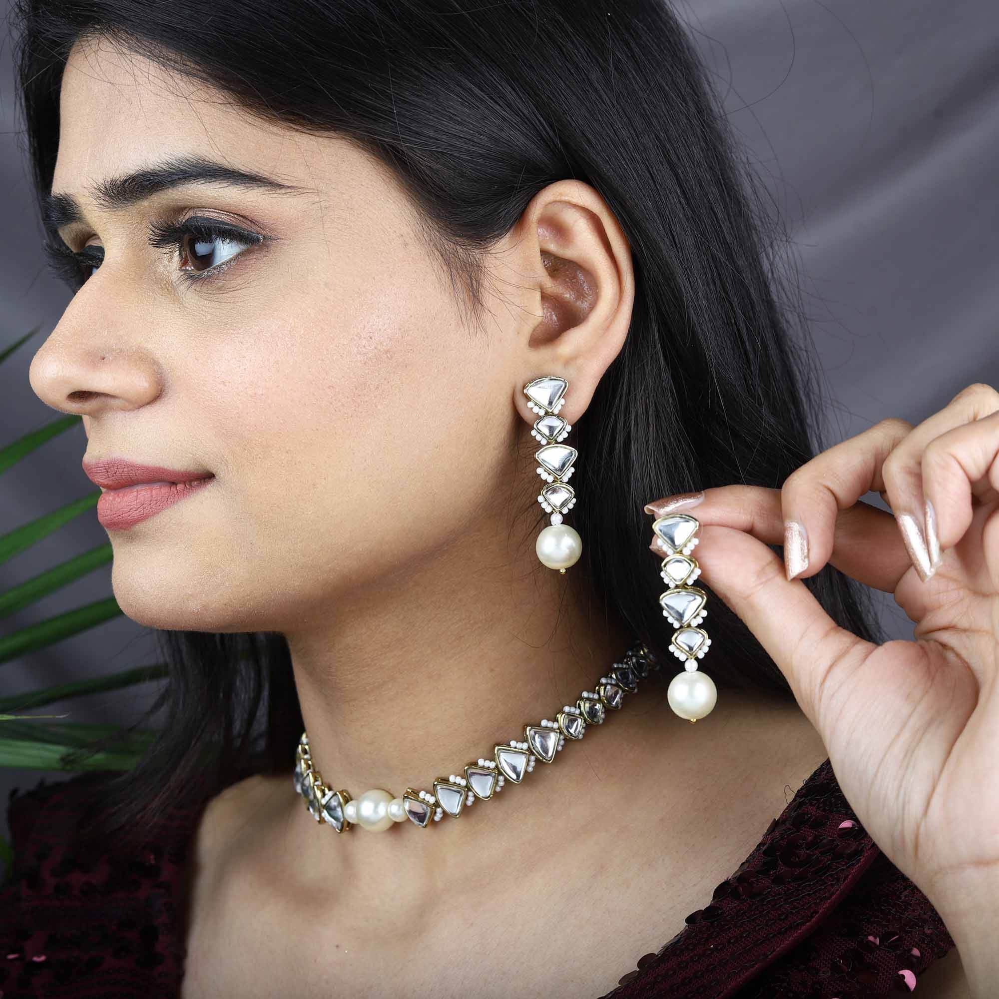 Traditional Kundan earrings in gold-tone, perfect for weddings and festive wear