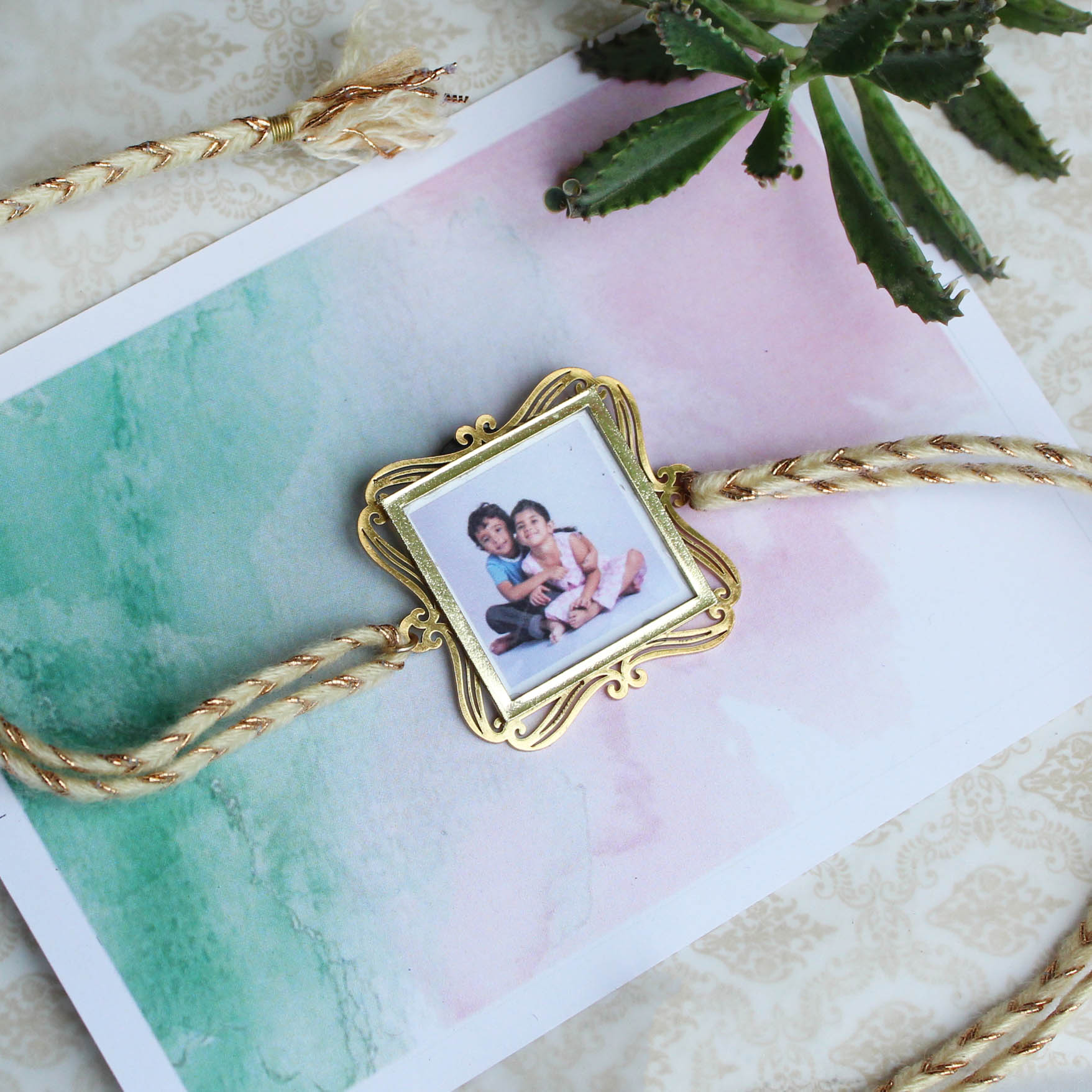 BeAbhika Gold Tone Photo Frame Designer Unqiue Famous Rakhi Lightweight Easy To Tie Rakhi Available At Best Price In India Online COD Available Send Rakhi To Brother Small Brother Big Brother Younger Brother Send Rakhi Abroad With Roli Chawal Capsules