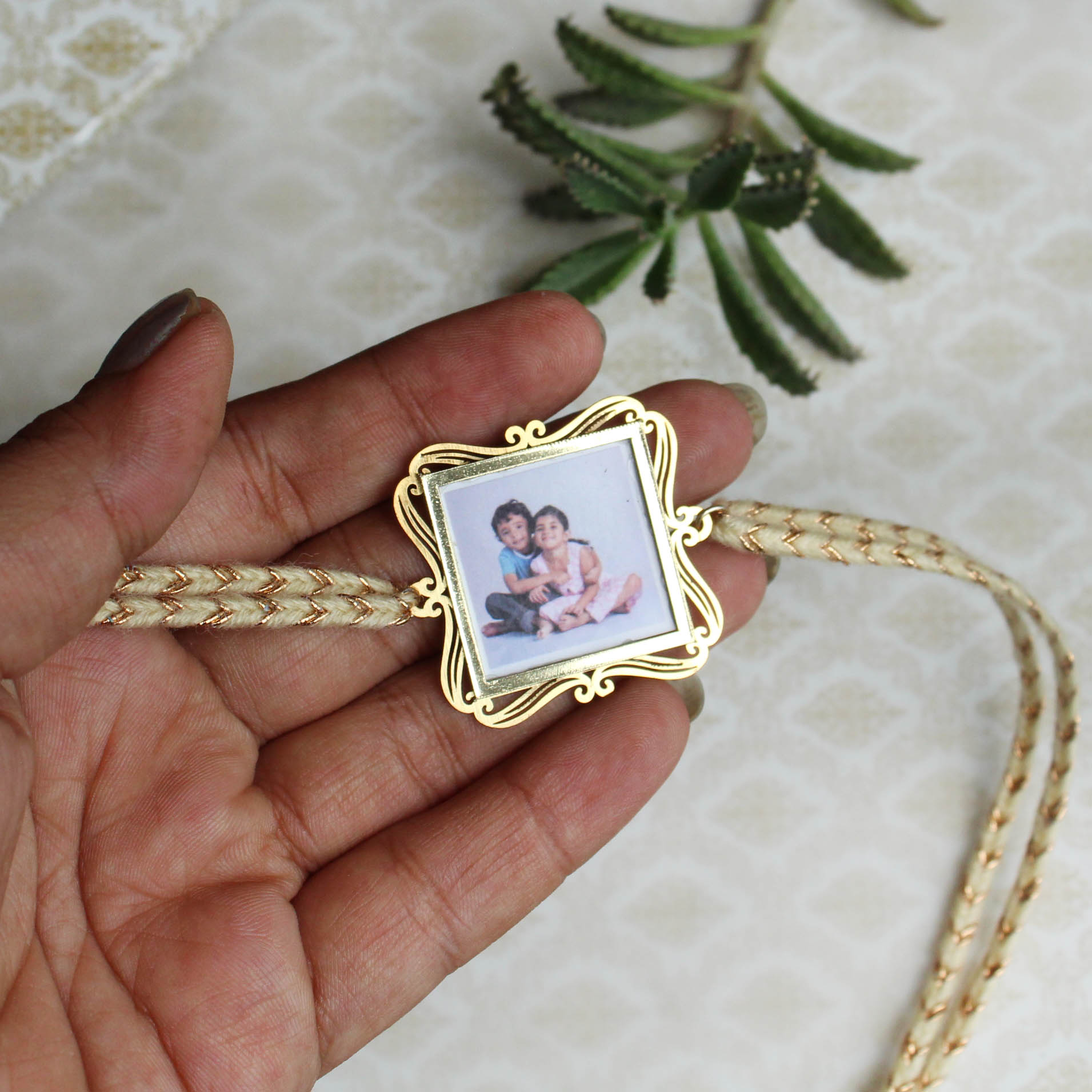 BeAbhika Gold Tone Photo Frame Designer Unqiue Famous Rakhi Lightweight Easy To Tie Rakhi Available At Best Price In India Online COD Available Send Rakhi To Brother Small Brother Big Brother Younger Brother Send Rakhi Abroad With Roli Chawal Capsules