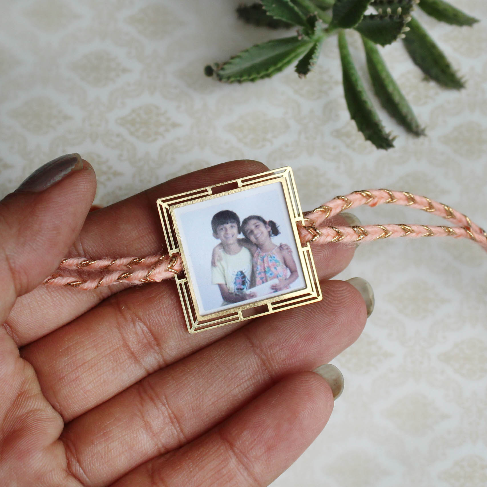 BeAbhika Gold Tone Photo Frame Designer Unqiue Famous Rakhi Lightweight Easy To Tie Rakhi Available At Best Price In India Online COD Available Send Rakhi To Brother Small Brother Big Brother Younger Brother Send Rakhi Abroad With Roli Chawal Capsules