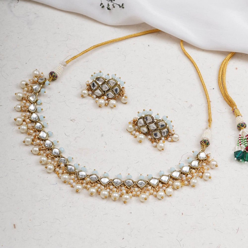 Kundan choker set in gold-tone with matching earrings and long bridal necklace, perfect for wedding functions , festive and bridal wear