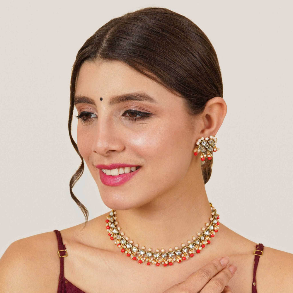 Kundan choker set in gold-tone with matching earrings and long bridal necklace, perfect for wedding functions , festive and bridal wear