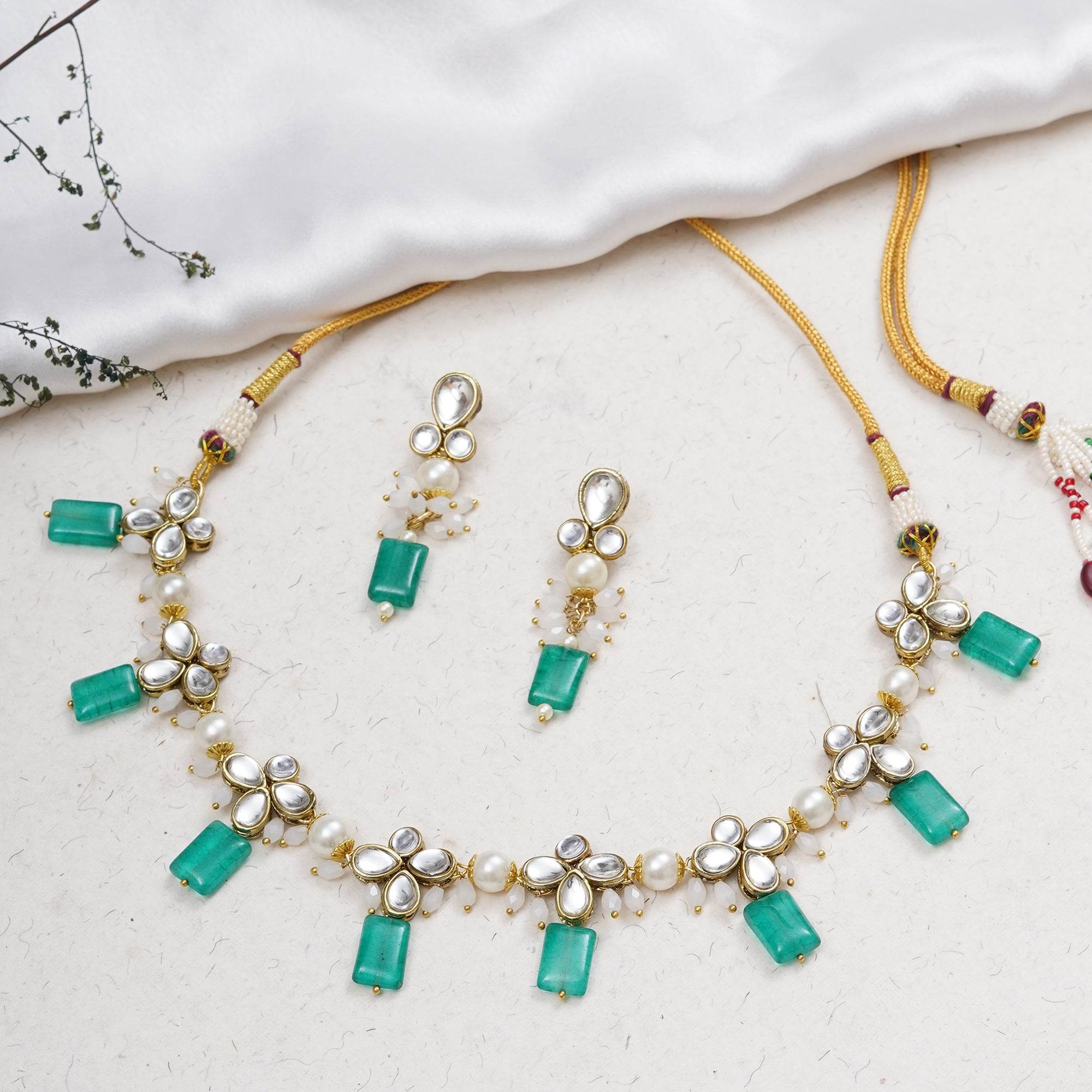 Kundan choker set in gold-tone with matching earrings and long bridal necklace, perfect for wedding functions , festive and bridal wear