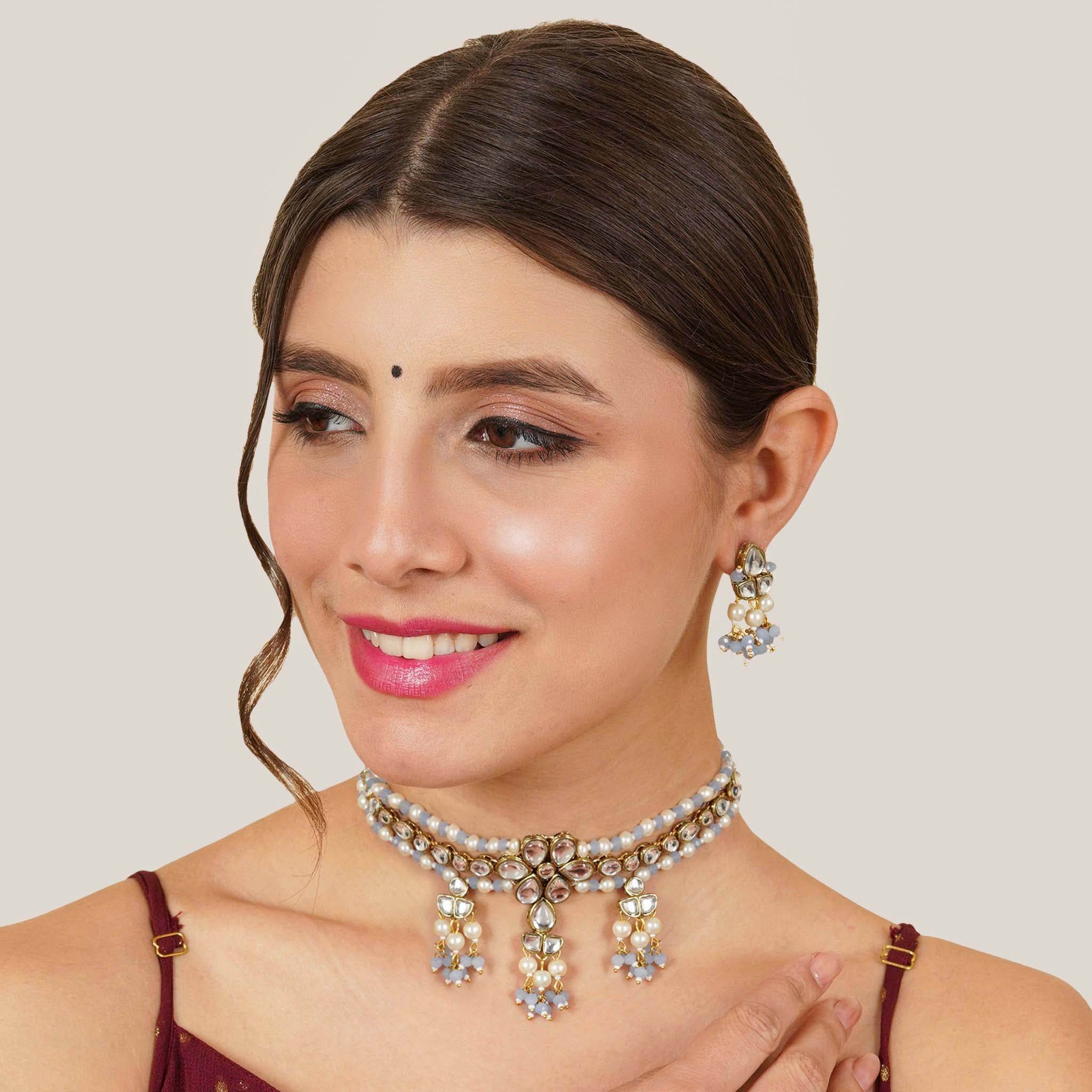 Kundan choker set in gold-tone with matching earrings and long bridal necklace, perfect for wedding functions , festive and bridal wear