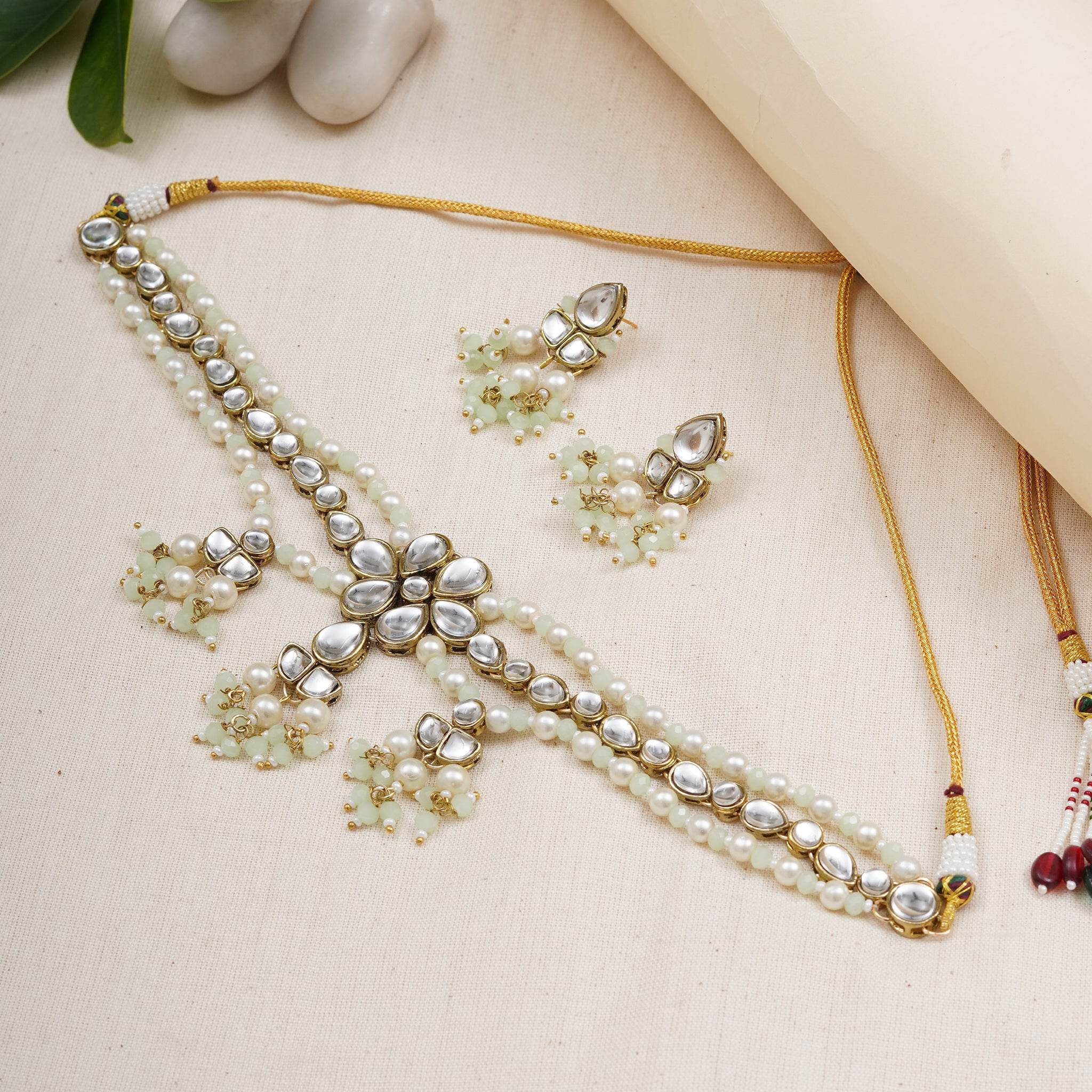 Kundan choker set in gold-tone with matching earrings and long bridal necklace, perfect for wedding functions , festive and bridal wear