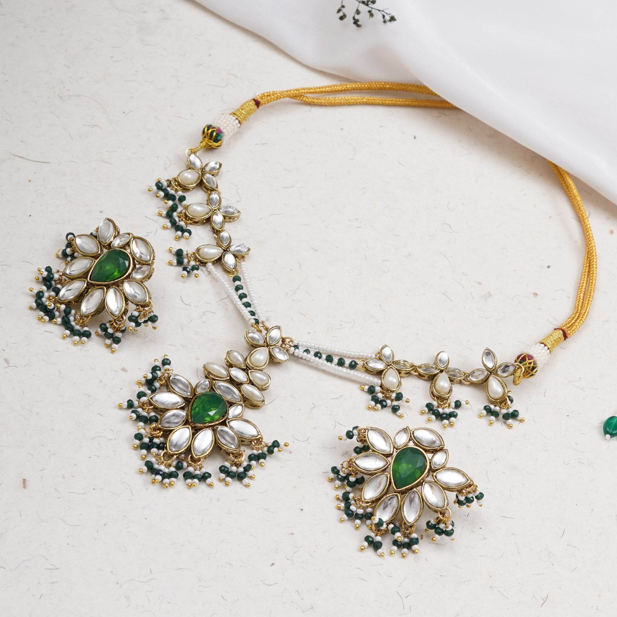 Kundan choker set in gold-tone with matching earrings and long bridal necklace, perfect for wedding functions , festive and bridal wear