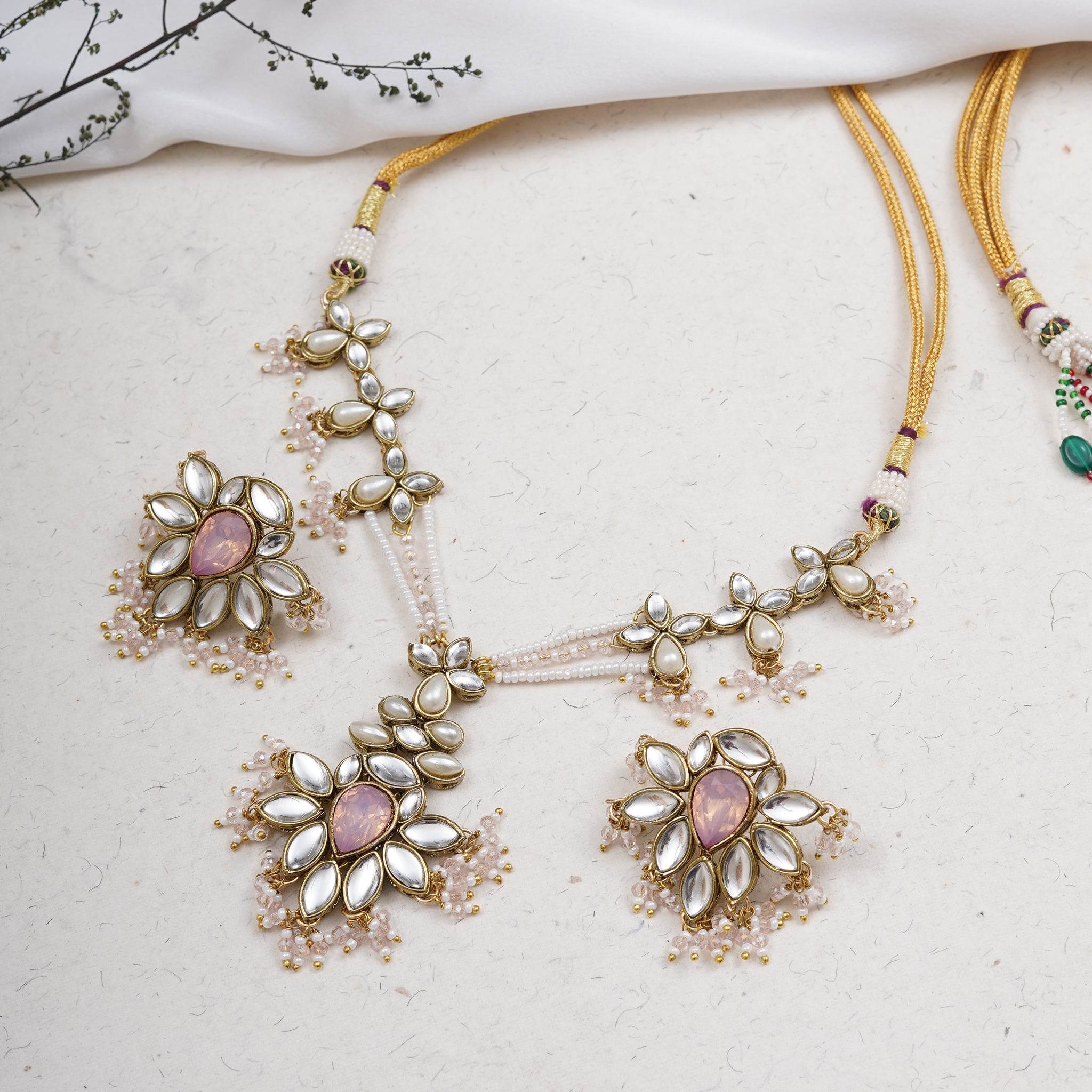 Kundan choker set in gold-tone with matching earrings and long bridal necklace, perfect for wedding functions , festive and bridal wear