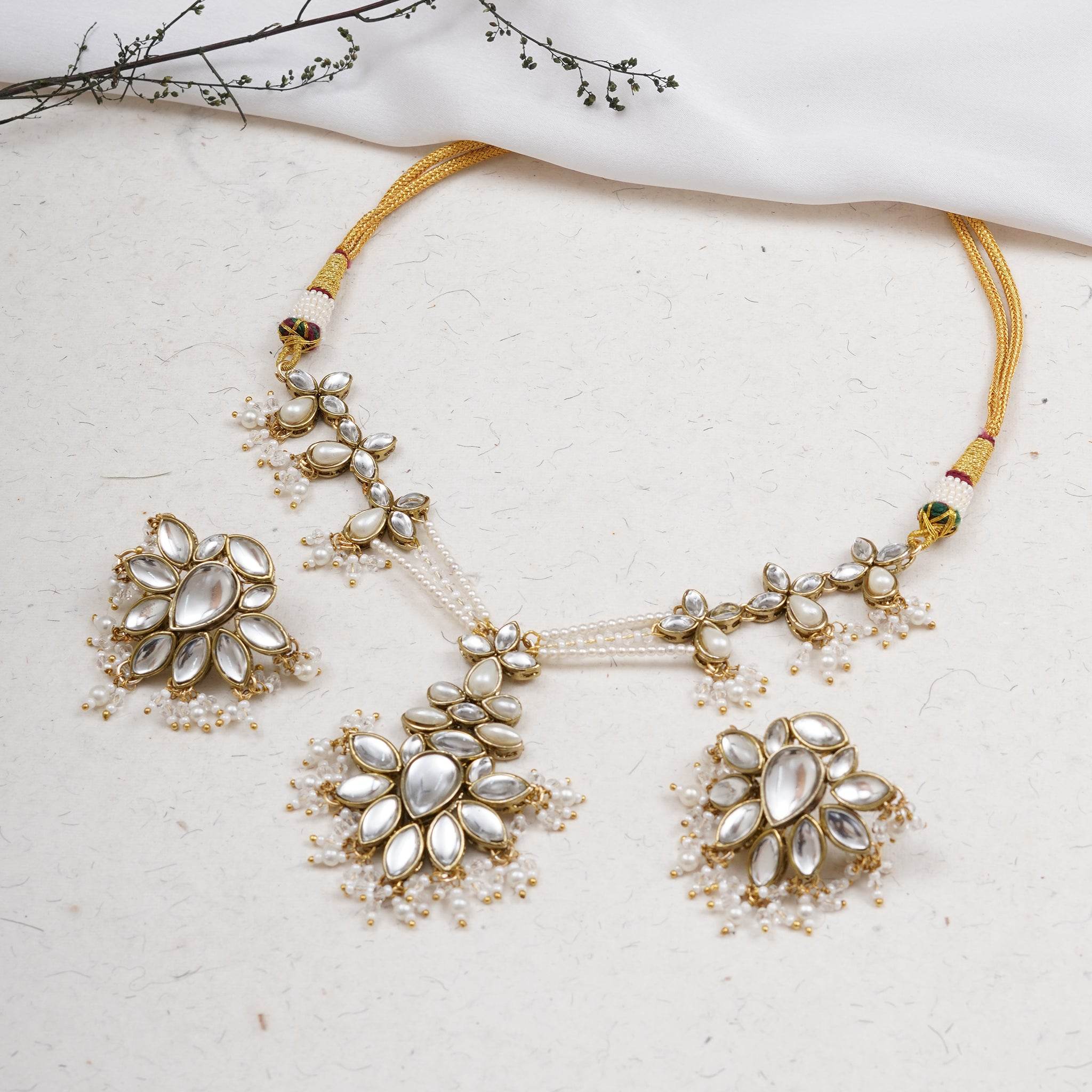 Kundan choker set in gold-tone with matching earrings and long bridal necklace, perfect for wedding functions , festive and bridal wear