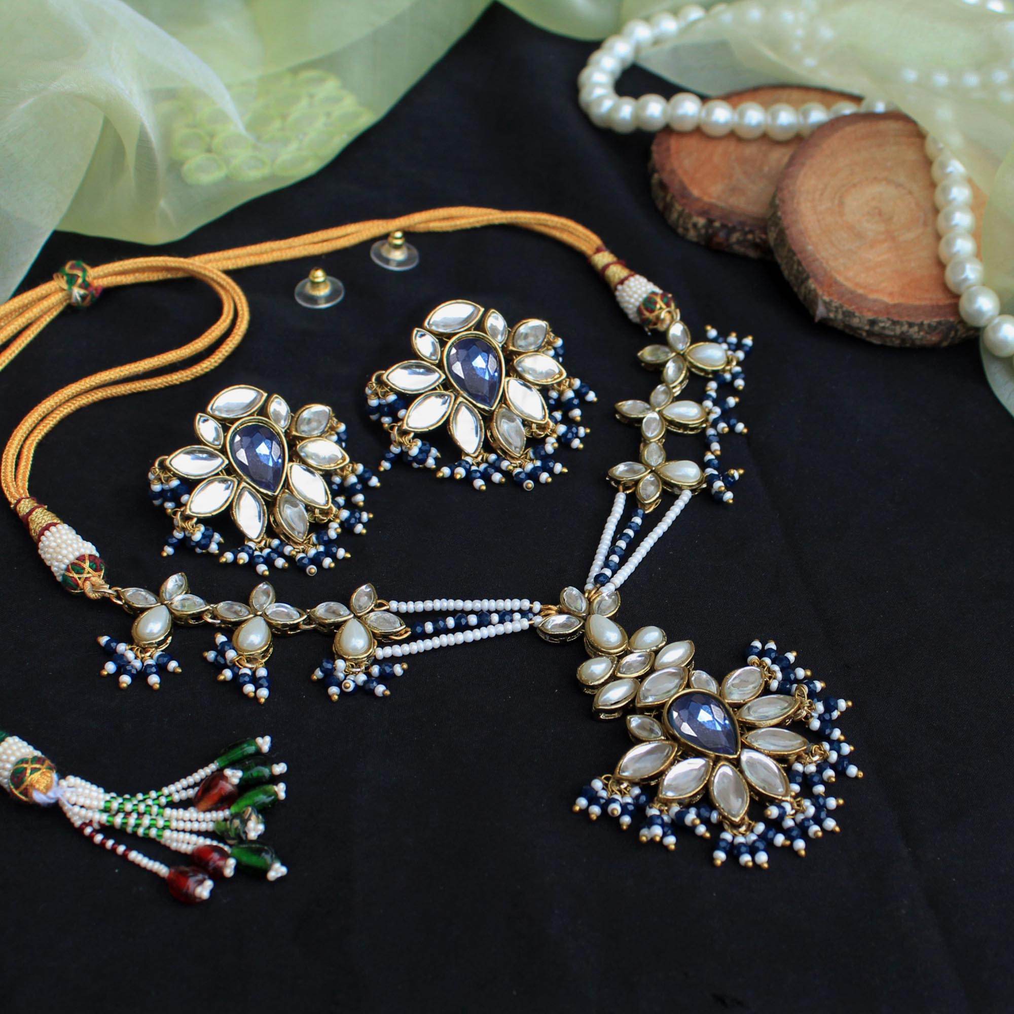 Kundan choker set in gold-tone with matching earrings and long bridal necklace, perfect for wedding functions , festive and bridal wear