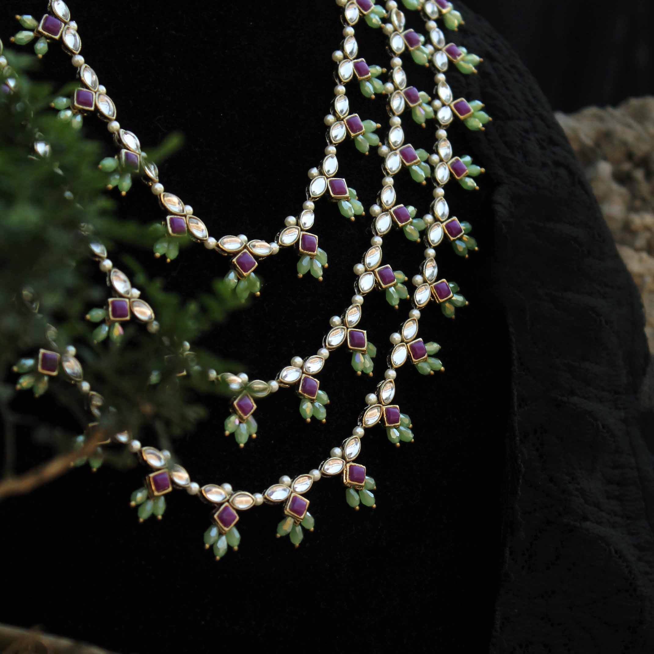 Kundan choker set in gold-tone with matching earrings and long bridal necklace, perfect for wedding functions , festive and bridal wear