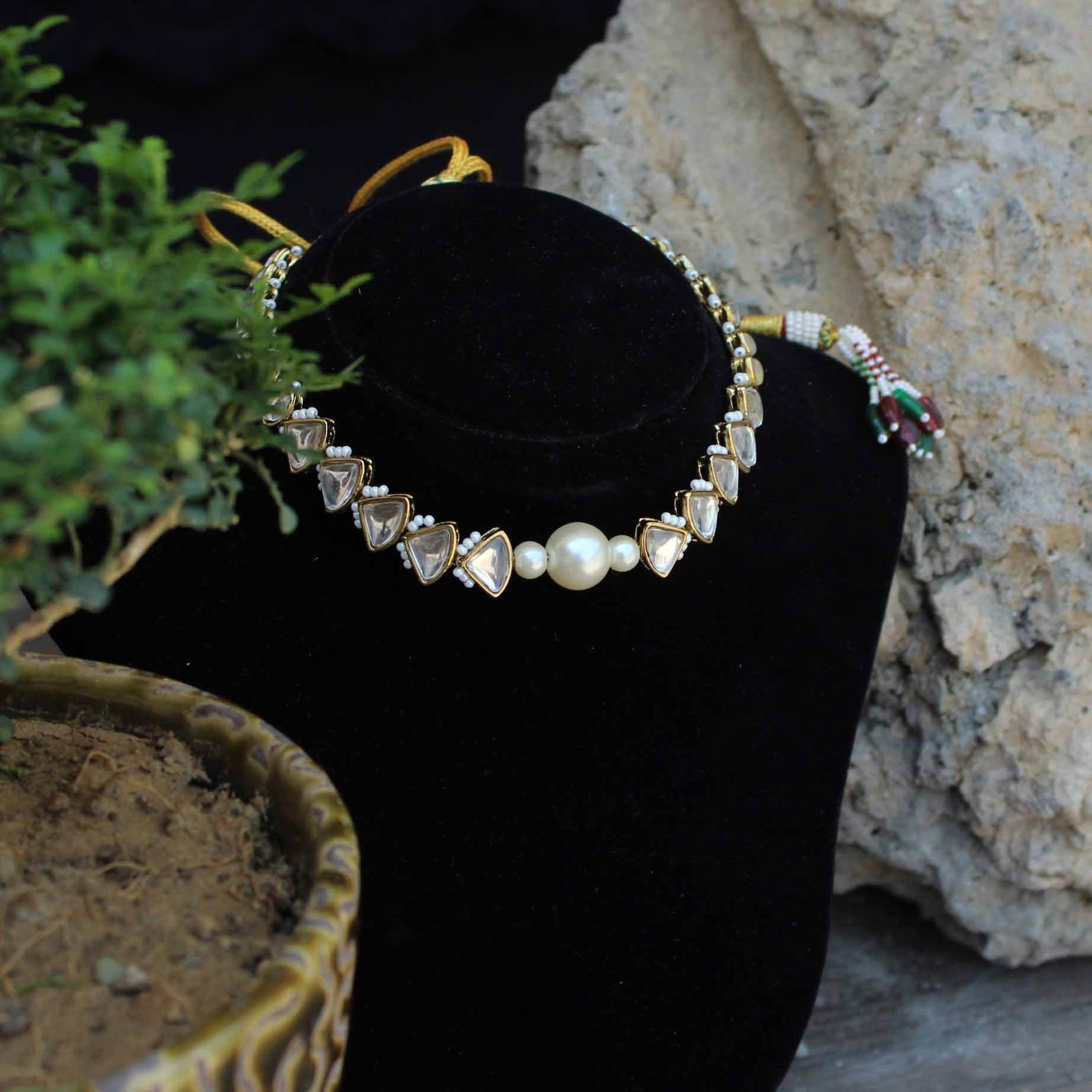 Kundan choker set in gold-tone with matching earrings and long bridal necklace, perfect for wedding functions , festive and bridal wear