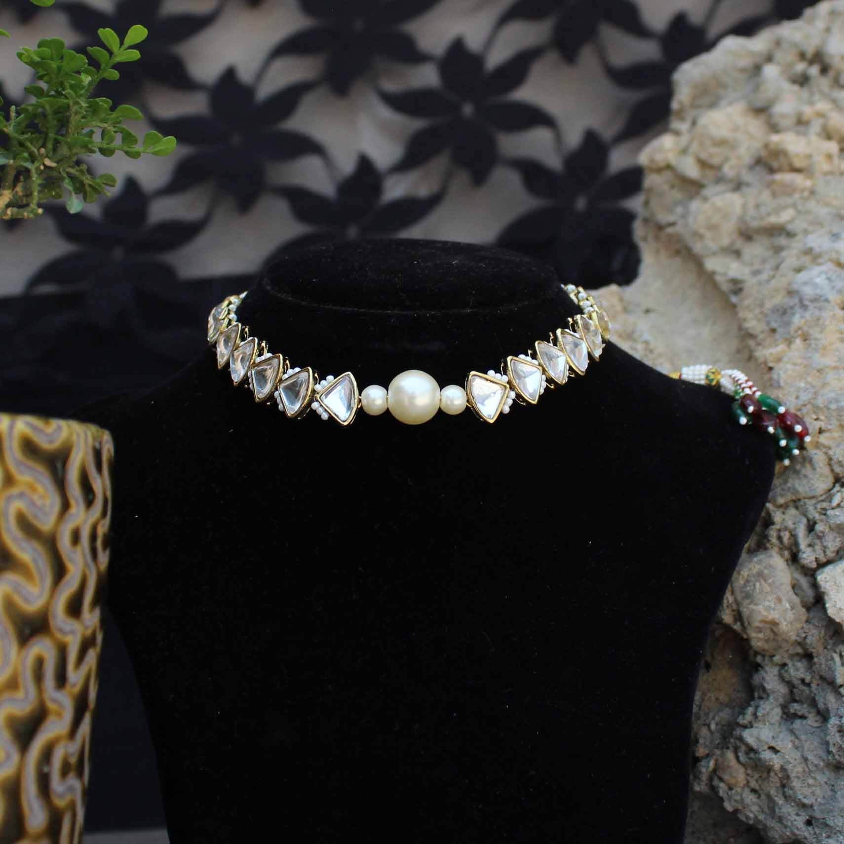 Kundan choker set in gold-tone with matching earrings and long bridal necklace, perfect for wedding functions , festive and bridal wear