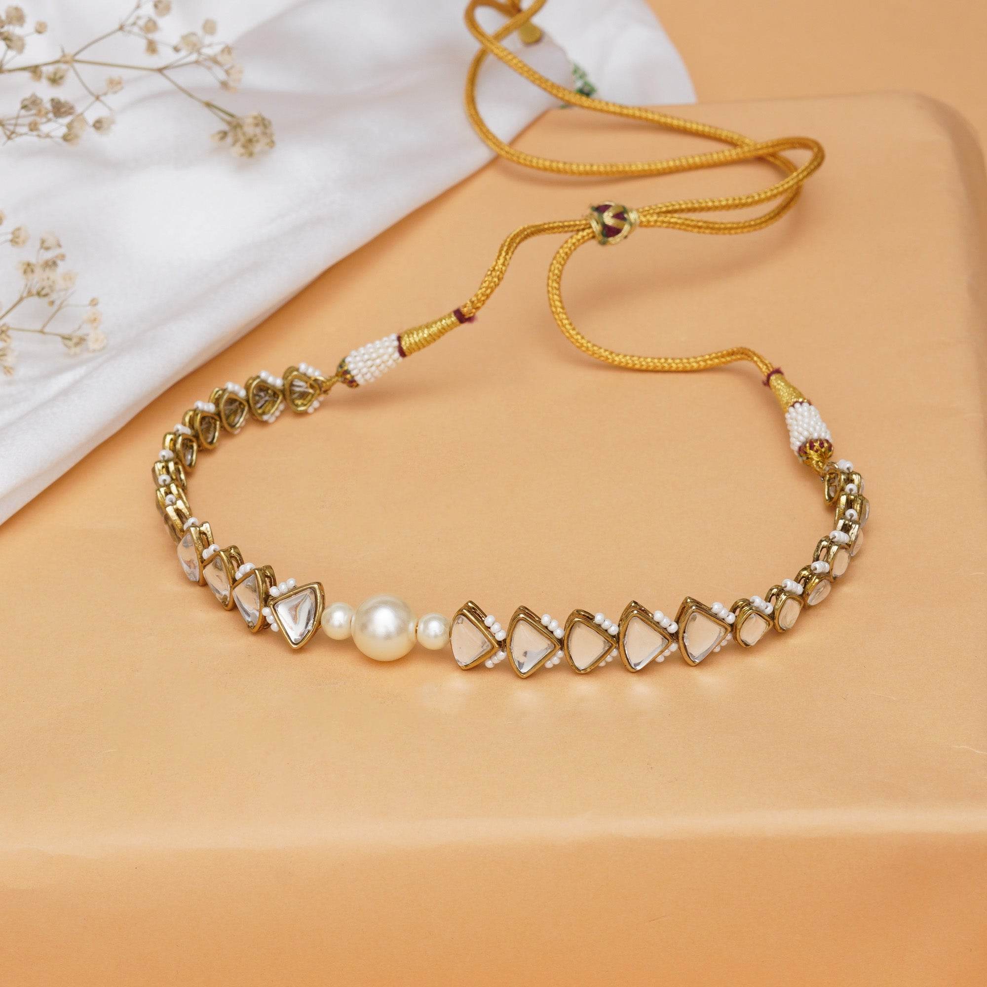 Kundan choker set in gold-tone with matching earrings and long bridal necklace, perfect for wedding functions , festive and bridal wear