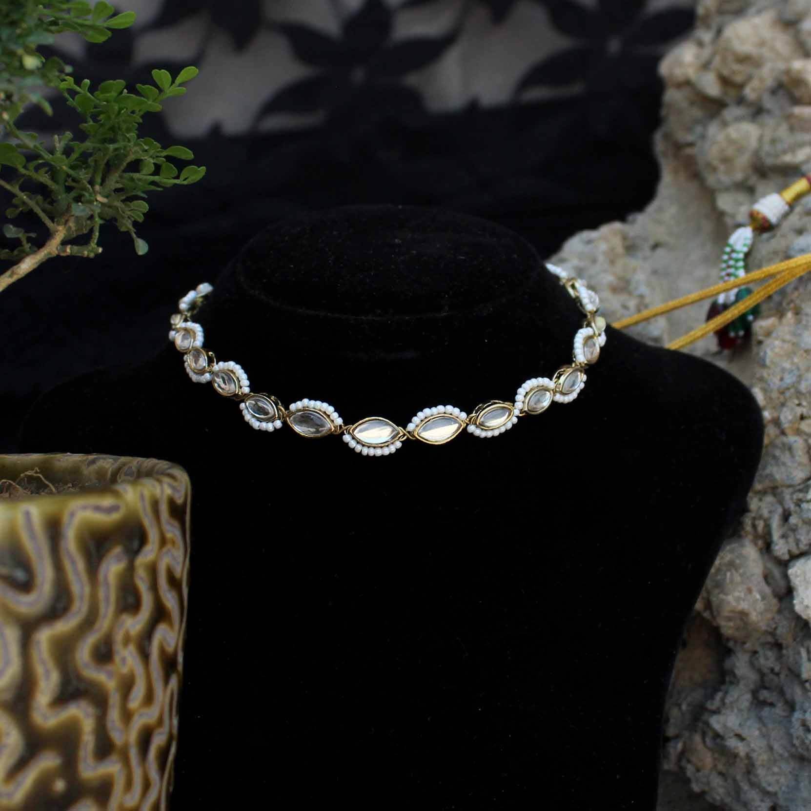 Kundan choker set in gold-tone with matching earrings and long bridal necklace, perfect for wedding functions , festive and bridal wear
