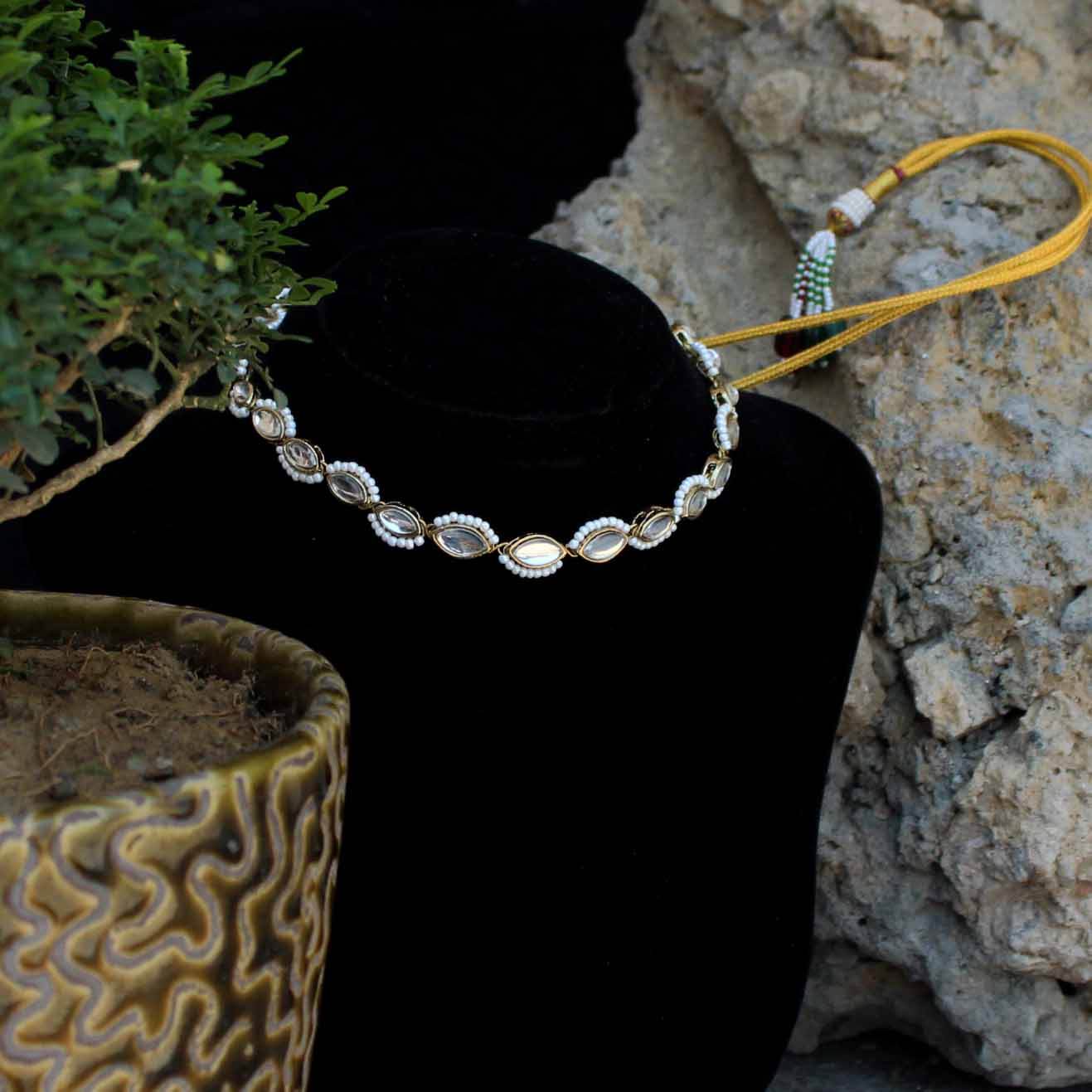 Kundan choker set in gold-tone with matching earrings and long bridal necklace, perfect for wedding functions , festive and bridal wear