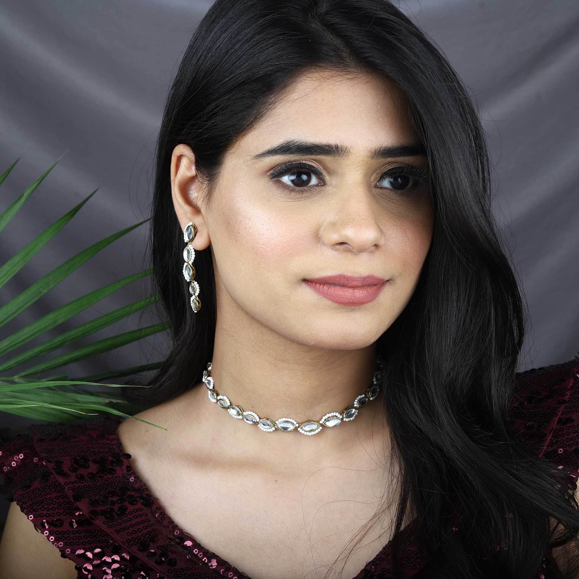 Kundan choker set in gold-tone with matching earrings and long bridal necklace, perfect for wedding functions , festive and bridal wear