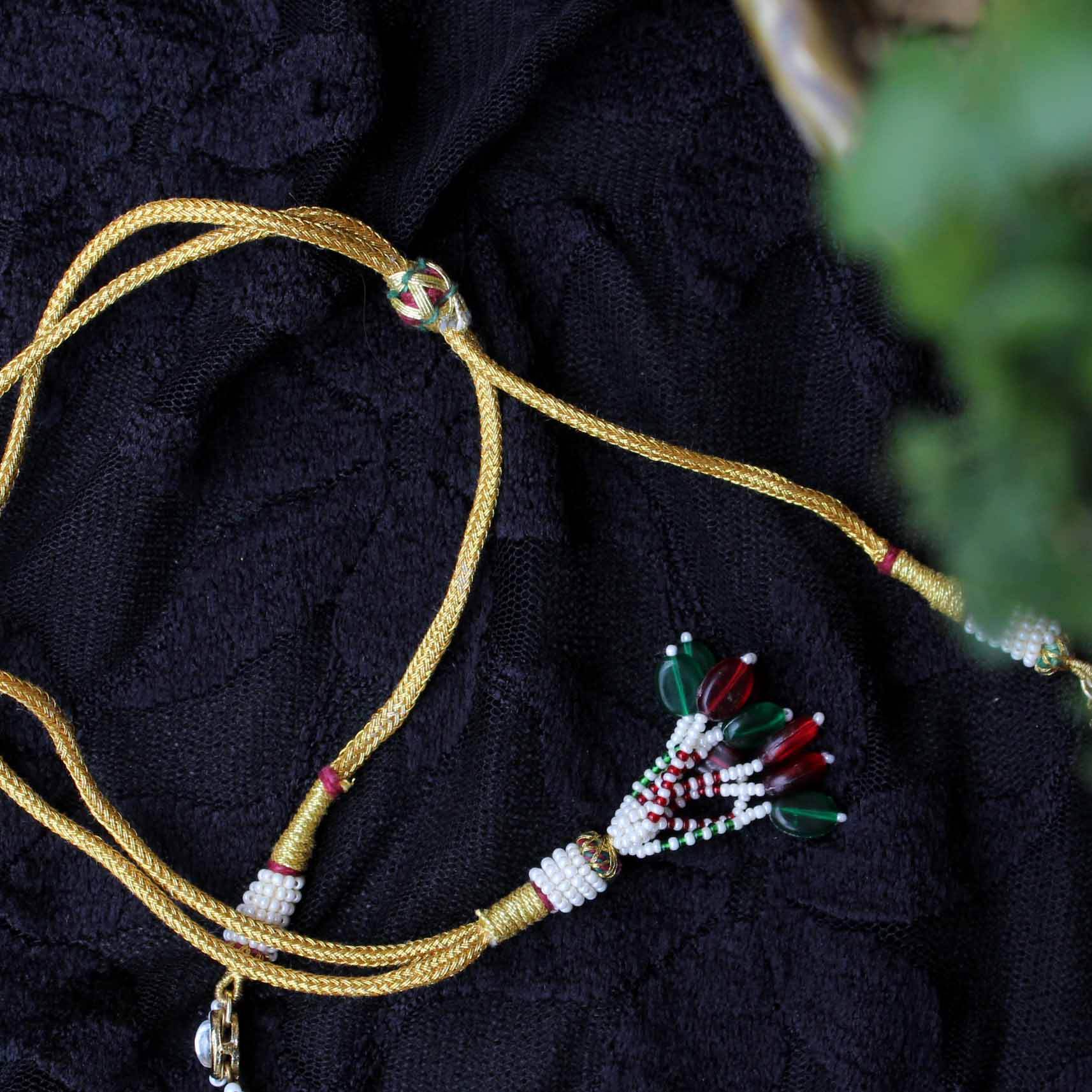 Kundan choker set in gold-tone with matching earrings and long bridal necklace, perfect for wedding functions , festive and bridal wear